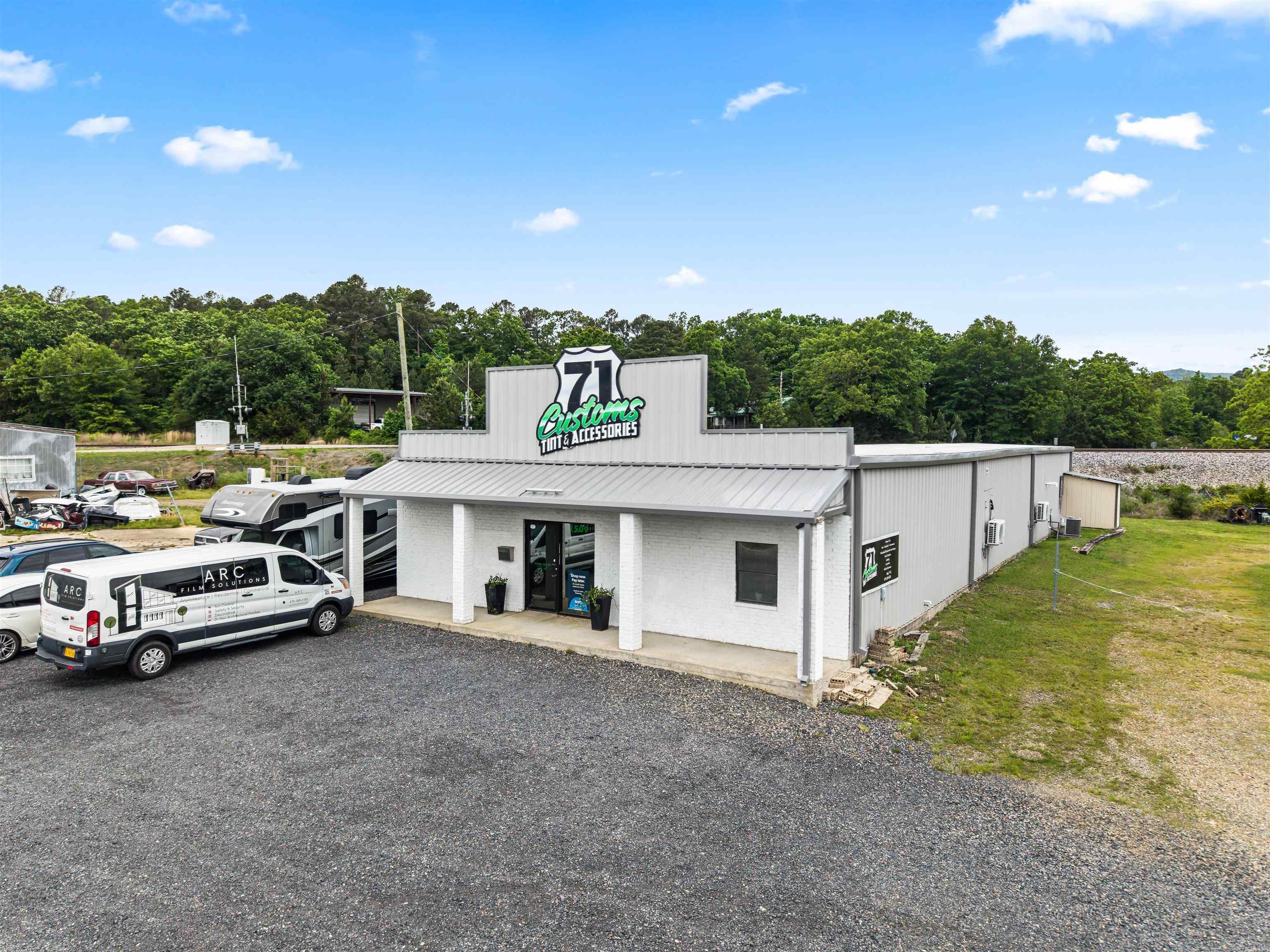 Turn-Key, expertly constructed COMMERCIAL shop on Highway 71! With 3400 sq ft. of useable space, this building is outfitted to be the perfect location for a car garage, bike shop or any other commercial venture! Features include 14 ft. ceiling throughout, THREE electric garage doors to a spacious shop, a large attractive front lobby, a private office, bathroom facilities, and tons of parking! The sky’s the limit with this one!