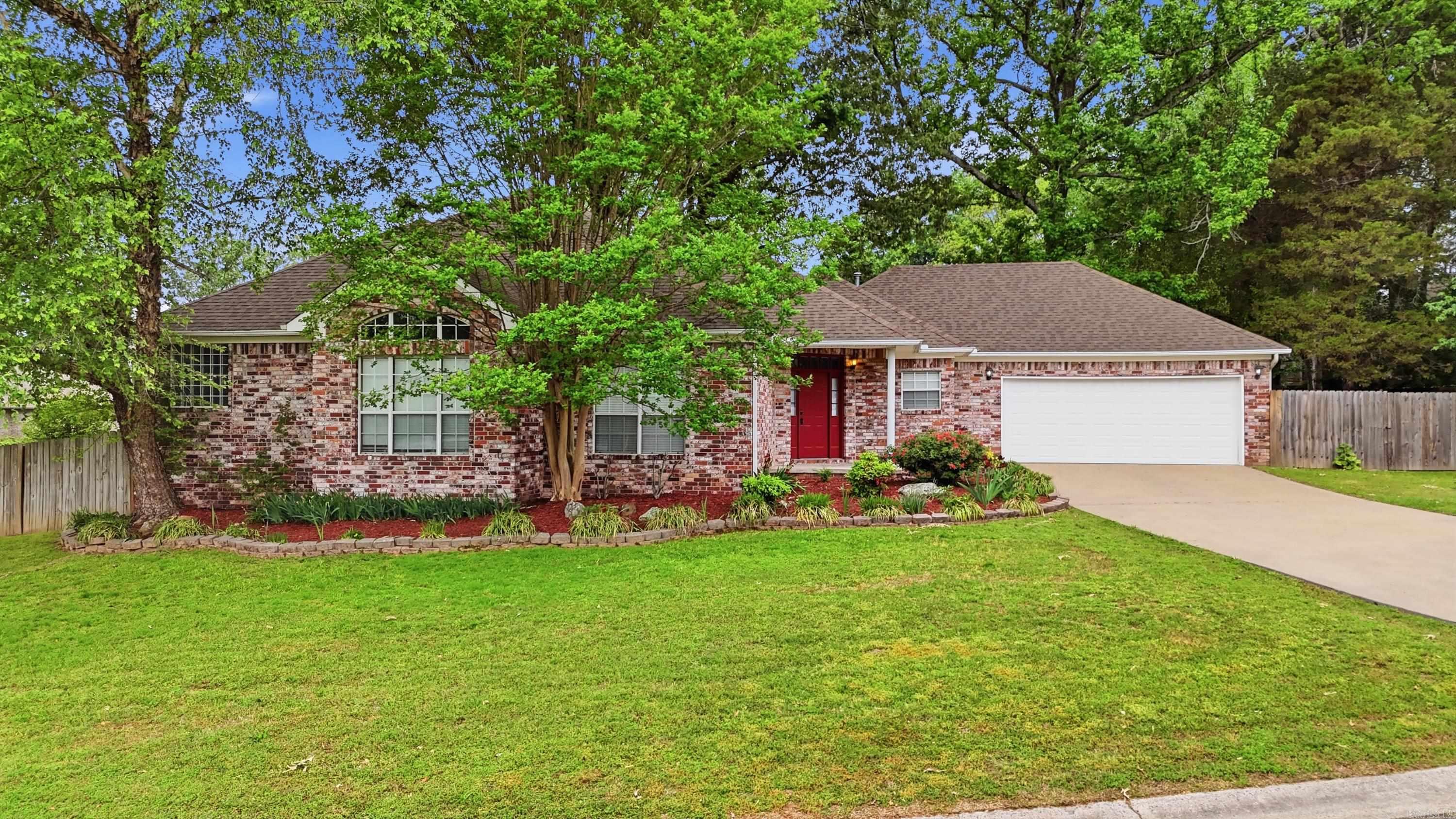 Located in an established subdivision in West Conway, this well-maintained brick home offers great curb appeal on a desirable corner lot with mature trees and landscaping. Inside, you’ll find a spacious living area with tall ceilings, abundant natural light, and a new gas log fireplace that creates a warm focal point. The layout flows easily into the dining and kitchen areas, making it ideal for everyday living and entertaining. The spacious primary suite provides a comfortable retreat, complete with a large walk-in closet featuring built-in shelving. Secondary spaces offer flexibility for guests, office, or hobbies. Step outside to enjoy the newly built deck, perfect for relaxing or hosting, along with additional covered patio space. The oversized garage adds extra room for storage or workspace. Additional updates include a roof replaced in 2022, giving peace of mind for years to come. Conveniently located near shopping, dining, and everything Conway has to offer, this home combines comfort, updates, and a prime location.
