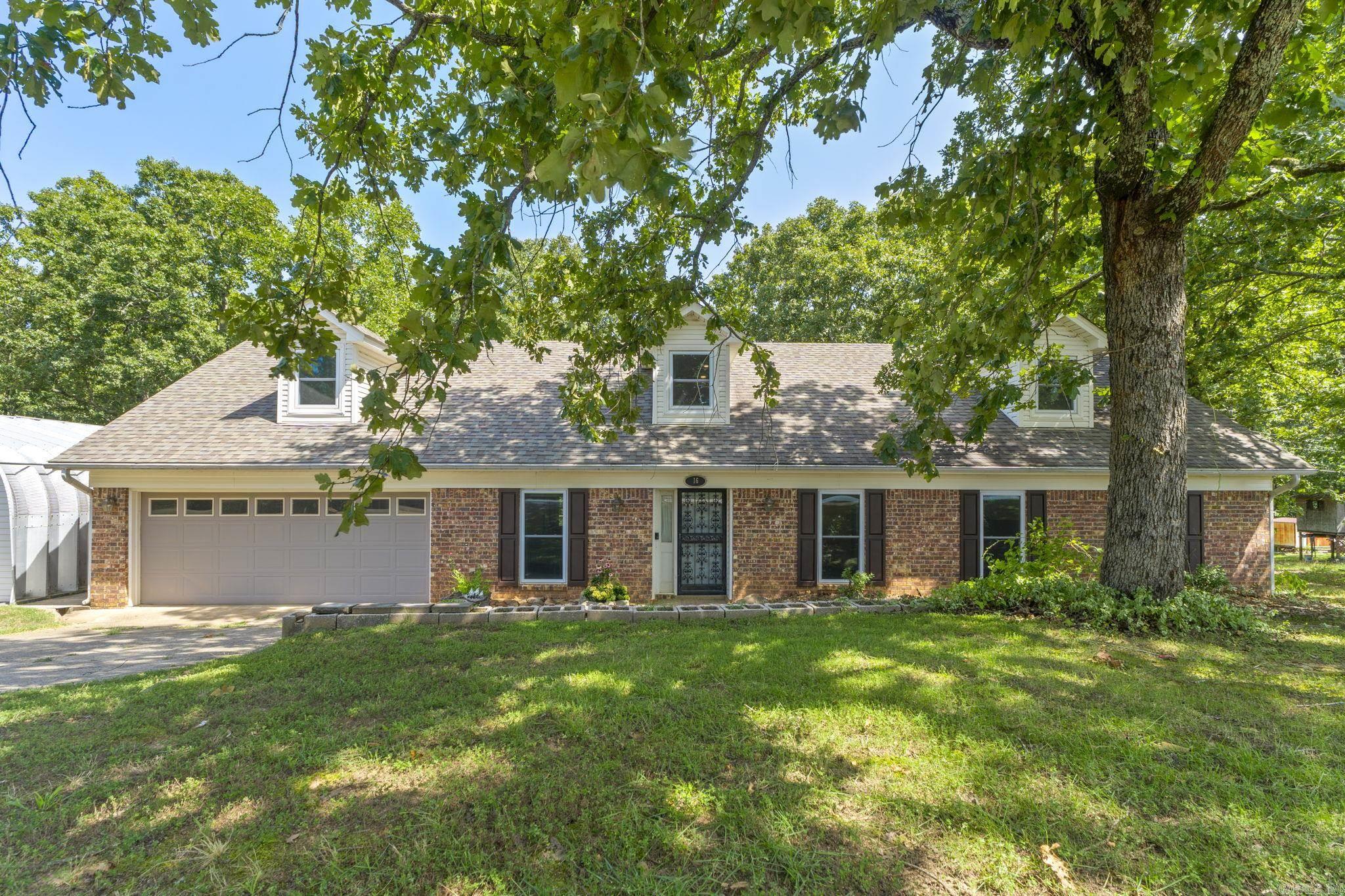 This beautiful home is located in the Peaceful Valley subdivision, less than 10 minutes from LRAFB. With 1500sqft of bonus space upstairs, this home is ready for anyone looking for extra room for activities. It sits on a double lot totaling .55 acres of fun, useful land and includes a 25x30' shop perfect for any hobbies or add'l storage. Enjoy evenings on the oversized deck that includes a fan cooled, covered sitting area. Downstairs features a fireplace and dining room. New windows 2017, roof est. 2016, and HVAC serviced 2026. Don't miss your opportunity at a beautiful home with tons of indoor and outdoor space!