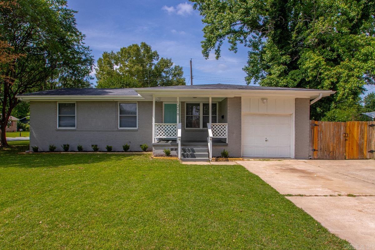 Fully remodeled and move-in ready! This charming 3 bed, 2 bath home sits on a desirable corner lot and offers stylish updates throughout. Inside, you’ll find new LVP flooring, fresh finishes, and a functional layout. The updated kitchen features beautiful quartz countertops and modern touches, while both bathrooms have been tastefully remodeled. The primary suite includes a private full bath for added comfort and convenience. Outside, enjoy a fully fenced backyard with plenty of space for kids, pets, or entertaining, and a new roof. Conveniently located close to schools and interstate access, making commuting and daily errands a breeze. Don’t miss this affordable home with all the updates already done for you!
