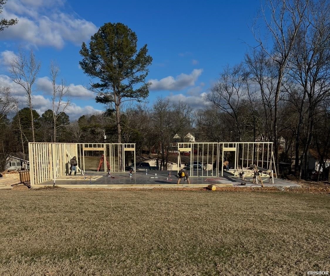 One of several new one-level homes beginning in the beautiful golf and boating community of Diamondhead in Hot Springs. This home offers 3 bedrooms and 2 full baths, along with an open plan overlooking an awesome golf front view of Diamondhead Golf Course. Enjoy loads of natural light throughout, and there are two outdoor porches to relax and take in the views of the course and nature. The primary bedroom has a luxurious on-suite with a huge custom walk in shower (complete with a bench and rain showerhead), plus a large double sink vanity with a granite top and plenty of storage, as well as a walk-in closet that will wow you! The custom kitchen comes with granite throughout, lovely shaker cabinets, a huge island for entertaining, beautiful stainless appliances, and a spacious walk in pantry! Located on Lake Catherine, this lush gated area offers golfing and boating, an outdoor pool, a clubhouse with a restaurant/bar and event rooms...and vistas that will take your breath away!