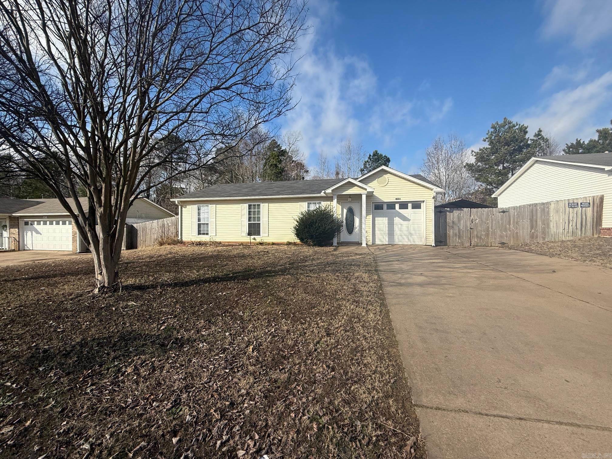 Welcome to this charming 3 bedroom, 2 bathroom home in the desirable location of Alexander, AR. This cozy house features a fenced-in yard, perfect for outdoor gatherings and pets to roam freely. Say goodbye to the hassle of laundromats with the convenience of a washer and dryer included. The absence of carpet throughout the home makes for easy cleaning and maintenance. The kitchen comes equipped with a refrigerator, providing added convenience for meal prep and storage. Additionally, the attached 1 car garage offers secure parking and extra storage space. Don't miss out on the opportunity to make this house your new home! This property accepts Section 8