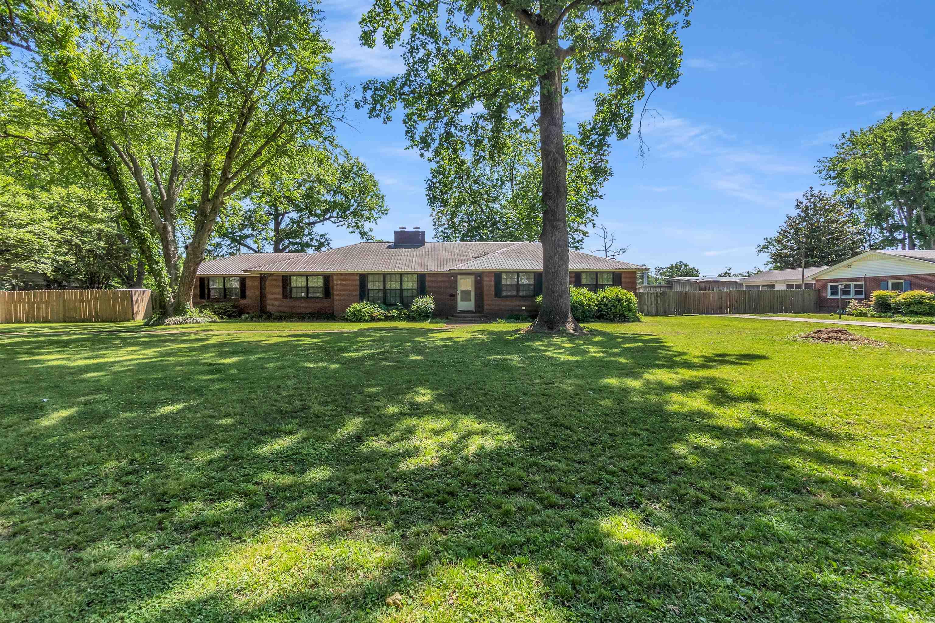 This is one house for you to have many family gatherings!! It offers 3 very spacious bedrooms, ample of closet space, 2 dens, a dining room, a living room, 2.5 baths, 3 fireplaces, one is gas burning and 2 are wood burning. It is sitting on a 1/2 acre lot, plenty of outdoor space for a cook out, too. A big kitchen makes entertaining a breeze, it is right by the dining room, and one of the 2 dens! So much space to enjoy and relax. Seller requires 24 hours notice before showing along with a pre-approval letter. Call to set up your appointment today.