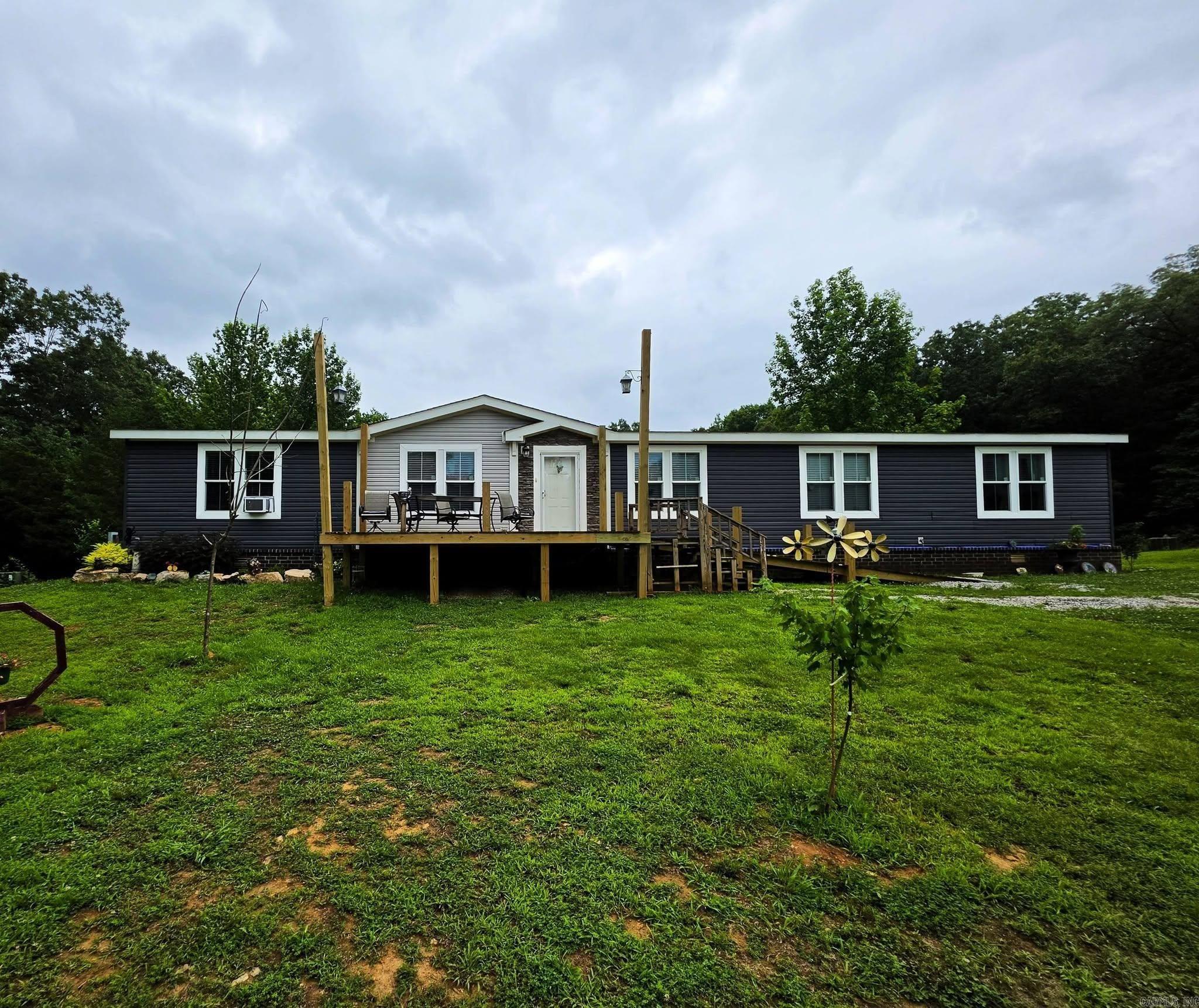If you’ve been dreaming of country living, this 40-acre property in Smithville has everything you’re looking for. The 2022 manufactured home sits under an architectural-shingle roof and offers 4 bedrooms and 2 baths, all-electric except for the cozy propane fireplace. Inside you’ll find stainless steel appliances, ceiling-mounted vents, and a new septic system installed in 2022. A pond and a creek run through the property, adding to the country setting.  The land is loaded with deer, turkey, and all kinds of wildlife, with beautiful timber and established hunting lanes already in place. A 40×60 shop with a full bathroom gives you plenty of room for equipment or projects. There’s also a 12×20 storage building with water, a 22×24 barn, and a 1-bedroom, 1-bath guest house feature 580 sqft +/- with its own electric meter and septic system. An RV hookup with 30-amp service on the property.  This place offers room to roam, and the kind of country setting that’s getting harder to find.