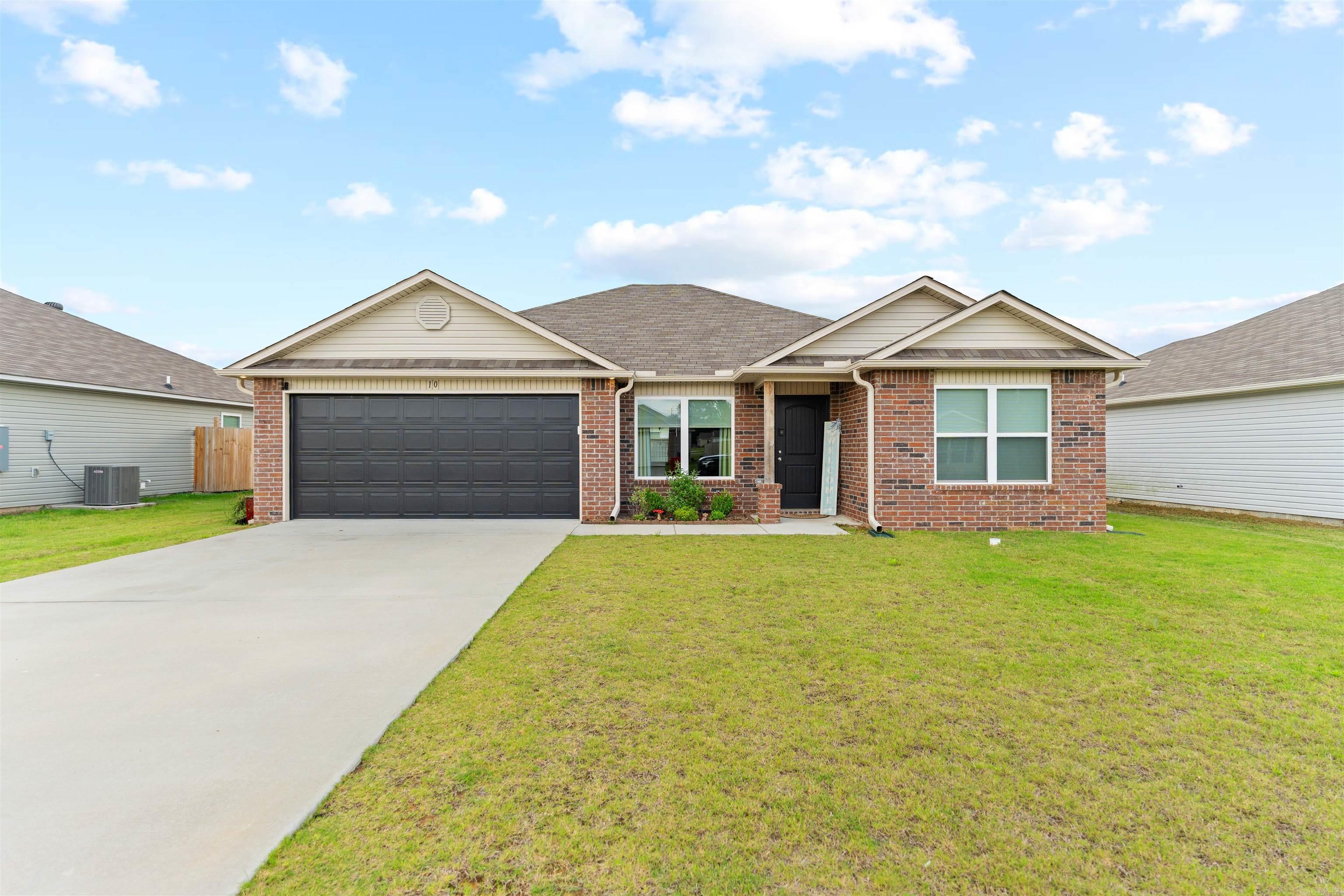 Tucked into one of Vilonia’s most peaceful areas, 10 Farmhouse Circle blends modern comfort with the kind of quiet you actually notice. From the open living spaces to the natural light pouring through the windows, this home feels warm, grounded, and easy to settle into. The layout gives everyone room to spread out while still feeling connected, whether you're hosting family, working from home, or enjoying a slow evening on the back porch.  Step outside and you’ll appreciate the fully fenced backyard, offering both privacy and space to relax, entertain, or let kids and pets roam freely. Combined with the open skies and slower pace that make Vilonia living so desirable, this property offers the balance of comfort, calm, and practicality that’s hard to fake in a listing and even harder to find in person.