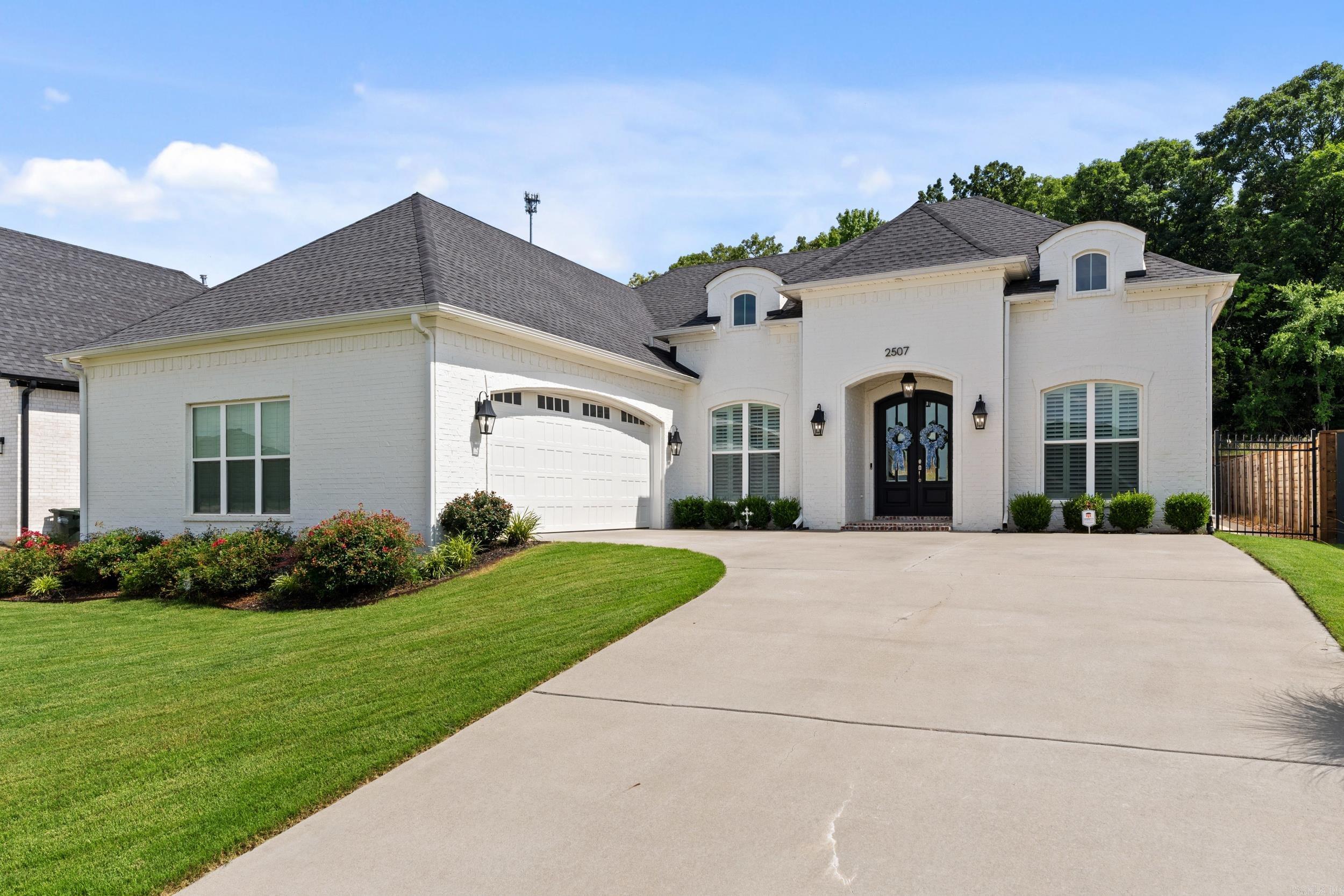 This stunning Robynmar home offers 3 bedrooms, 2 baths & dedicated flex room that can serve as a formal dining room, home office or additional living space to meet your needs. Gorgeous double front doors welcome you to the bright foyer that opens to a spacious living room featuring vaulted ceilings w/painted beams, gas fireplace & a statement chandelier. The kitchen boasts a large center island w/seating, custom cabinetry, stainless steel appliances, spacious walk-in pantry, eat-in breakfast area & separate formal dining area. The primary suite is a true retreat featuring: tray ceiling, arched entry to the luxurious bath, custom cabinetry, double sinks, separate vanity area & oversized tiled walk-in shower w/built-in bench & impressive walk-in closet w/abundant storage. The split floor plan includes two guest bedrooms w/generous closets & a beautifully finished shared hall bath. A well designed laundry room features extra storage & utility sink. Enjoy outdoor living on the covered back porch or the extended patio, perfect for entertaining. Oversized 2 car garage w/built-in & fully fenced backyard.