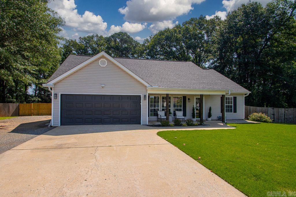 Turn-Key Home in the Heart of Bryant! This beautifully updated 3-bedroom, 2-bath home offers an excellent floor plan & exceptional indoor-outdoor living. The spacious heated & cooled sun-room provides the perfect space for relaxing or entertaining year-round. Situated on a fully fenced corner lot, the backyard is an entertainer's dream featuring a saltwater pool, an expansive deck, a charming fire pit area & a storage building. Additional side parking adds convenience for guests, recreational vehicles, or extra vehicles Major updates include roof (2020), HVAC system (2024), hot water heater (2026), pool conversion to saltwater with a new pump (2025) & new windows plus a mini-split in the sunroom (2024). Additional improvements include fresh paint, updated lighting, a new cedar front porch post & beautiful granite counter-tops installed in 2026.The inviting great room features a gas fireplace, while the laundry room includes a utility sink for added functionality.The home is also equipped w/a 30-amp generator inlet. The refrigerator conveys w/ the property. Don't miss this move-in-ready home loaded w/ updates conveniently located to I-30.  Full list of updates in associated docs.