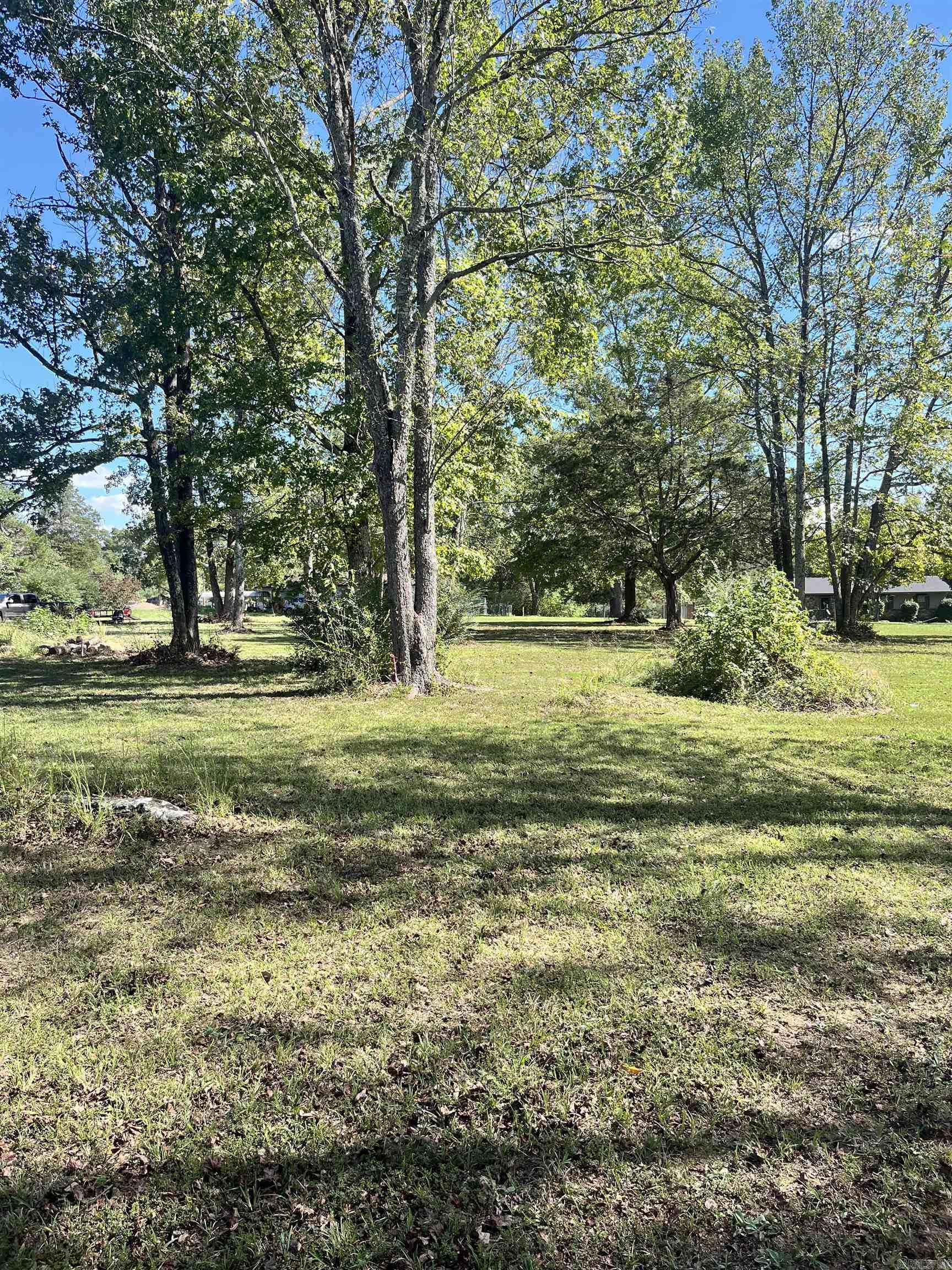 Build your dream home on this 2.37-acre property! This level tract is ready for your plans with a completed perc test and survey already in place. Set in a peaceful country setting, yet just minutes from town, you'll enjoy the best of both worlds—quiet privacy with convenient access. Beautiful mature trees provide a natural backdrop while leaving plenty of open space for construction. Don't wait—properties like this are rare to find!