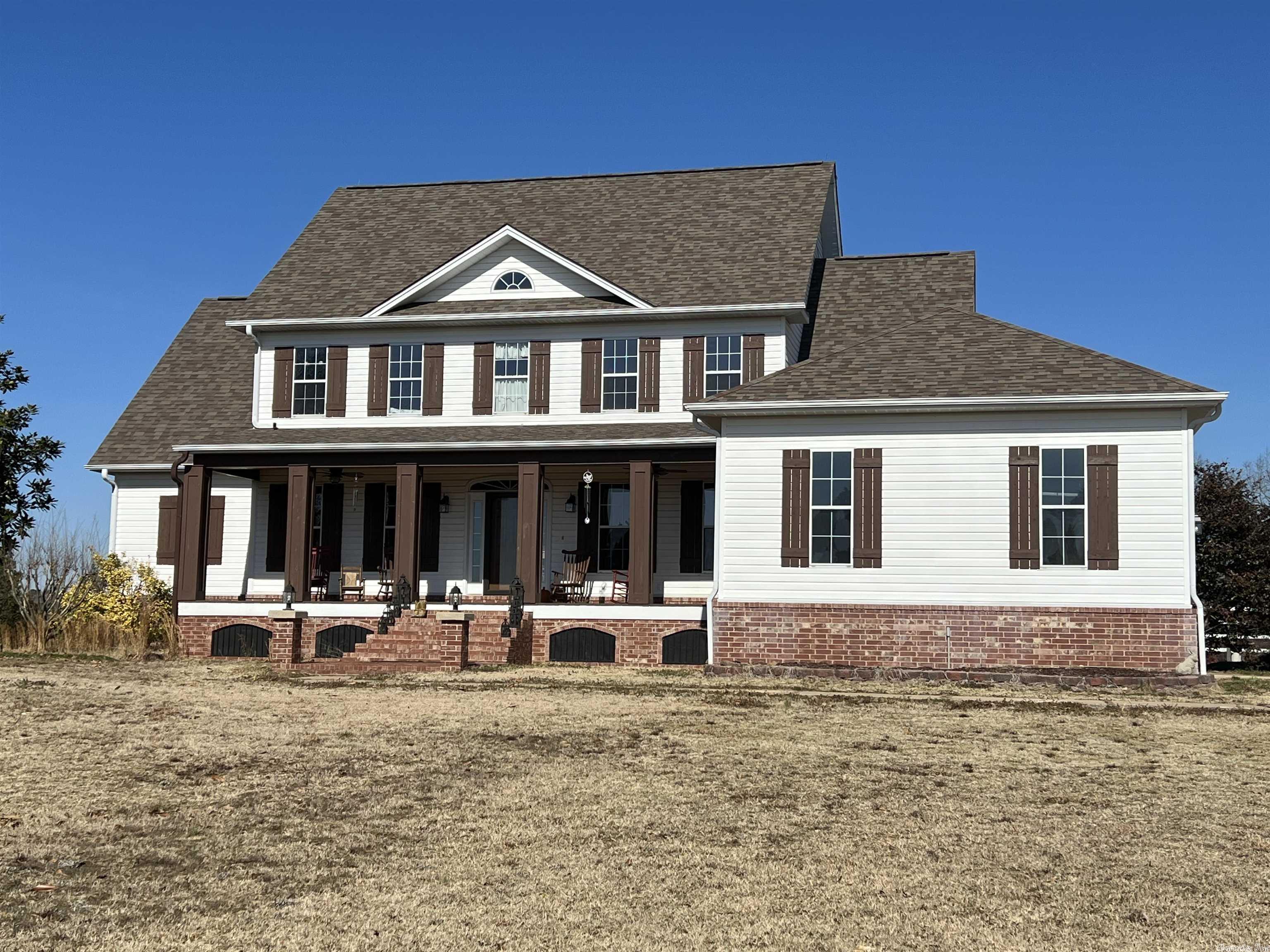 Located in the Gum Springs community, the ultimate in country living luxury is waiting for you. Completely remodeled with almost 4,000 sf which includes a finished basement, 5 beds and 3.5 baths, gourmet kitchen, new HVAC in 2022 and roof in 2017.The outdoor kitchen, pavilion and covered deck provide 640 sf of paradise and is positioned to see beautiful sunsets. Located on 80 acres with 4 ponds, stacked rock fence, crossed fencing, a 50 x 50 shop with lean to's and an asphalt and concrete drive and more!