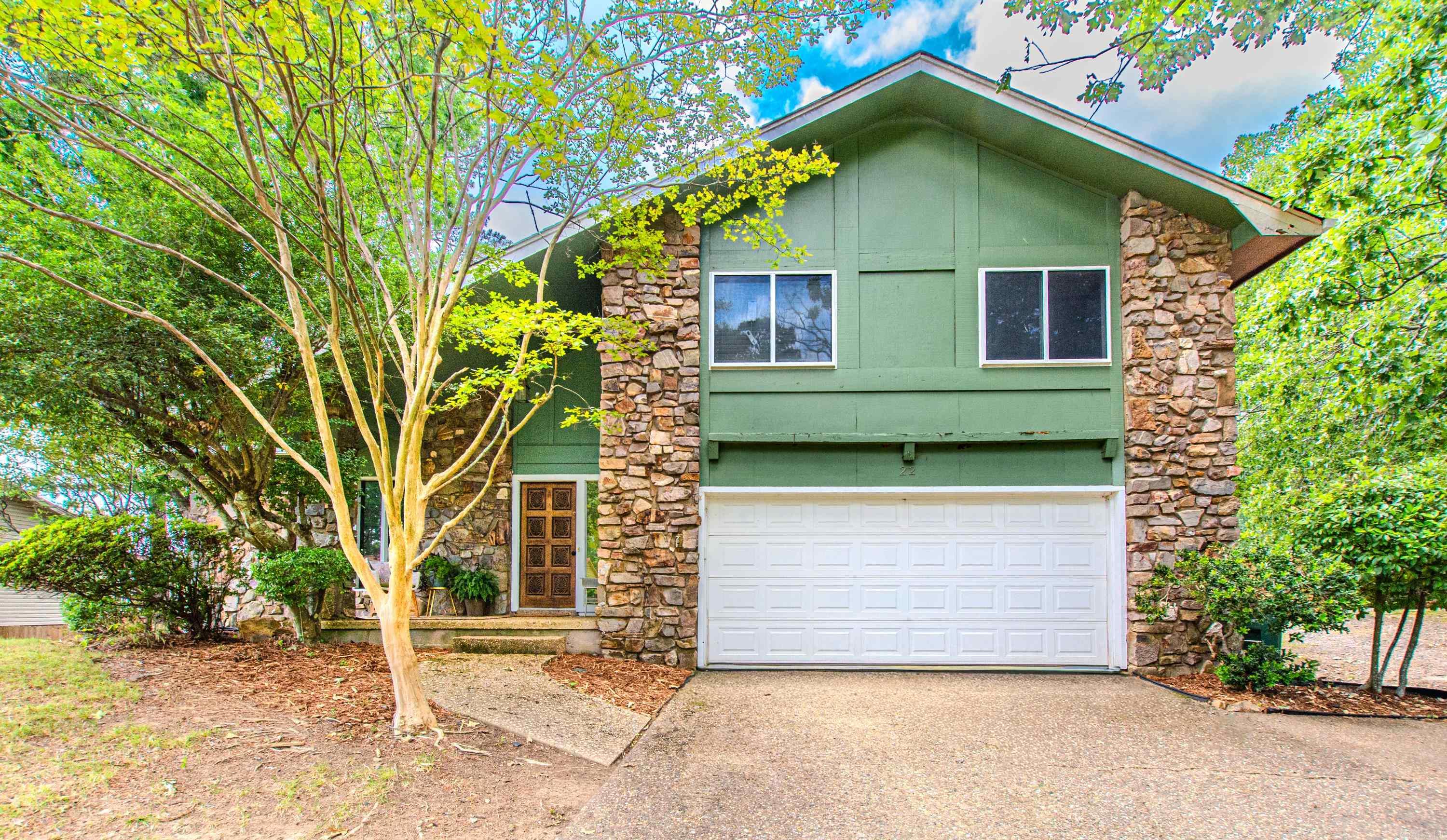 Ideally located on a quiet cul-de-sac with easy access to shopping, dining, and downtown, this updated home is move-in ready and perfect for entertaining. The huge family room features cathedral ceilings, wall-to-wall windows, and a stunning stone fireplace. The updated kitchen includes granite countertops and stainless steel appliances. Enjoy your morning coffee or entertain guests in the screened porch overlooking the private 1/2 acre lot, fully fenced backyard, and spacious deck. Three oversized bedrooms and updated baths. Sparkling hardwood floors, lovely built-ins, and contemporary touches throughout. Brand-new roof installed in May 2026. Beautifully maintained home with style and practicality throughout.