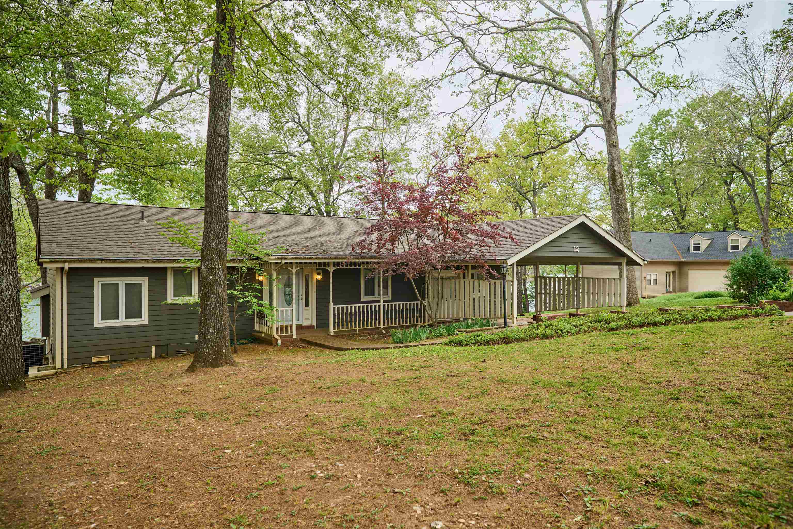 Lake Thunderbird home now on the market!! This 3 bedroom 3.5 bathrooms could be the perfect Lake home for you & your family. Home is located on a  culd-d-sac point w/a  vista view. Floor to ceiling windows offer a great lake view.  Home features luxury maple plank flooring through out the open concept living/dining/kitchen great room. There is loft guest room on the upper level & the primary bedroom and bath is on the main level. Off the foyer is another full bath for visiting guest There is another guest room off the foyer with it's own bath. For additional sleeping, there is a bunk room. The laundry room & half bath is located off the kitchen. The screened porch leads outside to staggered decks going to the lake. There is a matching boat house another detached storage building for lake toys & lawn tools. The boat dock has a boat lift for off season storage. This property offers easy lake access. Cherokee Village amenities include 2-18 hole golf courses, pools, tennis courts, walking trails, 2 recreation ski lakes & 3 other fishing lakes. Spring River is about 10 minutes away for canoeing, kayaking & rafting. For family or a vacation home, consider this home for your investment.