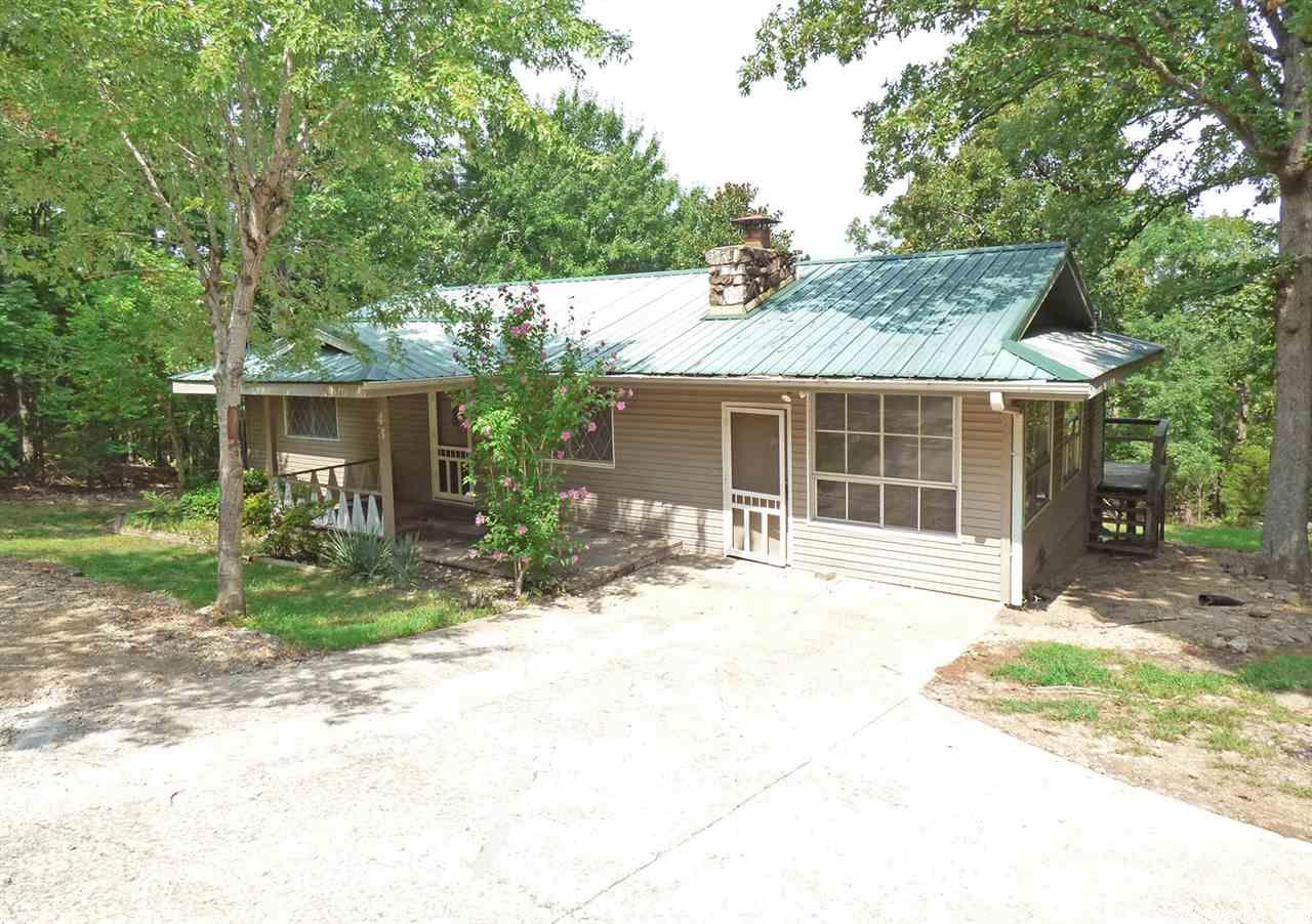 Nice Home in Private Location - This 2 bedroom, 1-3/4 bath home offers a living room with vaulted ceiling and gas log fireplace, large bonus room that could be a third bedroom; family room; craft room; office; etc., hardwood flooring, covered back deck, vinyl siding and privacy. contact the office soon and see this home. New H/Vac system 2016. Agent Owned.