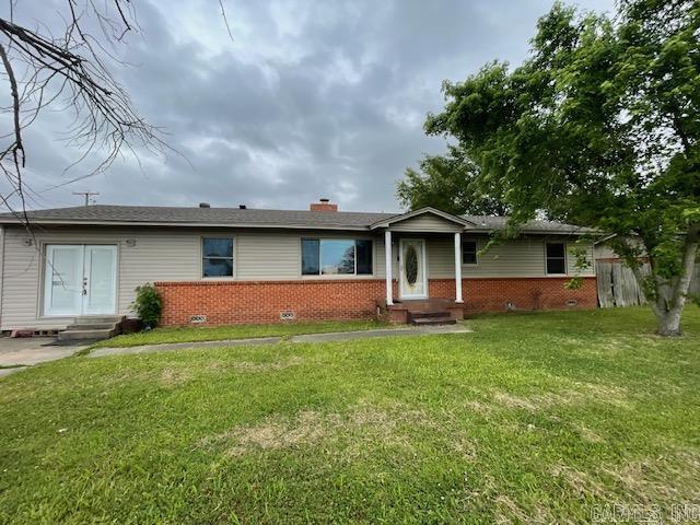 House sitting centrally located on the corner.  Spacious storage and deck off back.  Circle drive connecting 19th and Buerkle.  Home being sold as is.