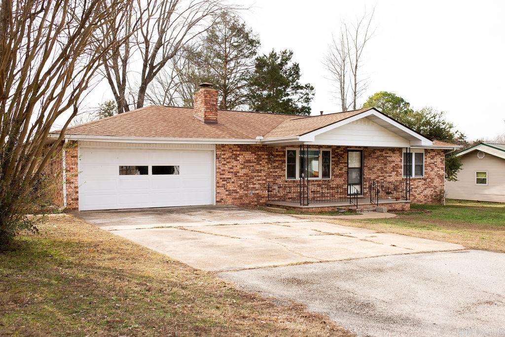 This is one of those homes that doesn’t come around often. Right in the heart of town, it offers the convenience everyone wants plus two additional lots. You’re just minutes from the hospital, shopping, dining, and daily necessities, making life here easy and efficient.  Whether you envision a larger yard, a future build, or an investment opportunity, this property gives you options without sacrificing location. It’s comfortable, well-situated, and full of potential—an in-town home that truly stands apart.  Buyer to verify lot dimensions.