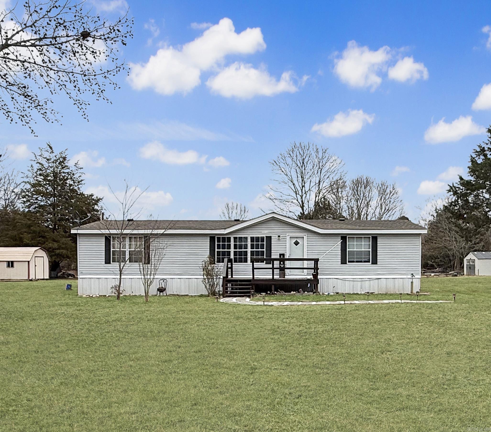 Welcome to 144 Valley Oaks Dr. in Heber Springs, Ar! This well maintained 3 bedroom, 2 bathroom home offers 1568 sq. ft. of comfortable living space and sits on 1.00 Acres, giving you both privacy and room to enjoy the outdoors. Centrally located, you're just 10 miles from Greers Ferry Lake and only 2 miles from the Little Red River. The perfect place for access to boating, fishing, and enjoying all that Heber Springs has to offer.  Inside, you'll find a spacious living area that flows into the dining room and kitchen, creating an open and functional layout. The kitchen features ample cabinet and counter space, built ins, and a pantry. Sliding glass doors off the dining area lead to a large back deck ideal for relaxing or entertaining.  The split floor plan offers privacy with two bedrooms and a full bath on one side and a spacious primary suite on the other. The primary bath includes dual sinks, a walk-in shower, garden tub, and access to the laundry area. A 12x16 storage building and separate RV Hookup add extra convenience. Schedule your showing today and call this your NEW HOME!