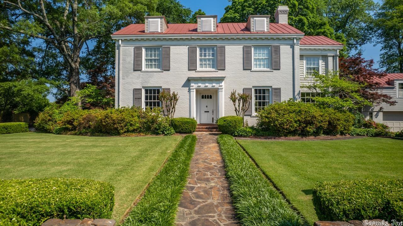 Classic beauty in Prospect Terrace! One of the landmark homes of the neighborhood, this Heights home sits on a near ½ acre flat landscaped lot with mature trees.  Large, inviting formal rooms with hardwoods and tall ceilings are filled with natural light.  Extensive kitchen remodel in 2012 with stainless appliances. Primary bedroom has two large closets, en suite bath, and nice sized office or living space off the bedroom. Two additional beds share hall full bath. 4th bedroom and full bath, plus tons of storage, is accessed by separate staircase on opposite side of home - perfect for guests, teens, or in-laws. Beautiful flagstone patio with site-built outdoor fireplace and television cabinet. Two car garage and gated dog pen.  The 500 sf basement (not included in sq footage) is heated and cooled, making the perfect playroom, wine cellar or exercise room. Abundant storage in attic. A rare find, come see!