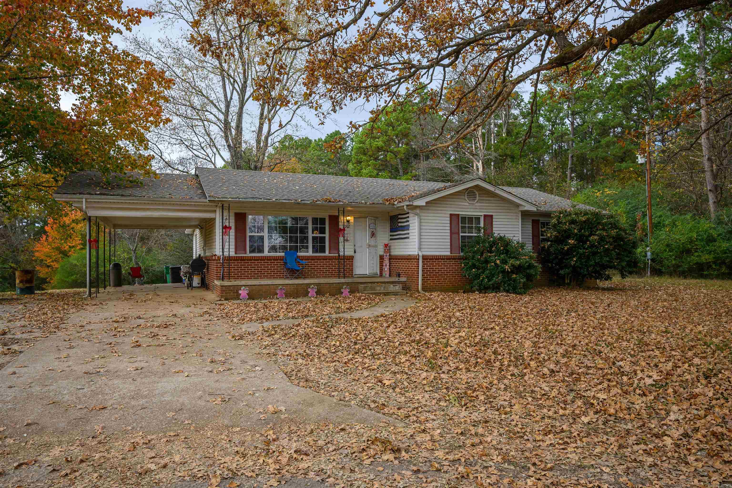 This well-maintained home sits on Highway 167 and offers three bedrooms plus a bonus room that could function as a fourth bedroom with its own attached bath. The home has been partially updated, thoughtfully cared for, and rests on 8.07 +/- acres surrounded by beautiful trees that create a sense of privacy despite the highway frontage. The spacious yard provides plenty of room for a garden, small animals, and outdoor activities, and also features a pond and a small, wooded area. Next to the home is a 1,964 sq ft building that once operated as a restaurant and is currently used for storage, offering excellent potential for future business or personal use. The home is currently rented, so showings will need to be scheduled in advance.