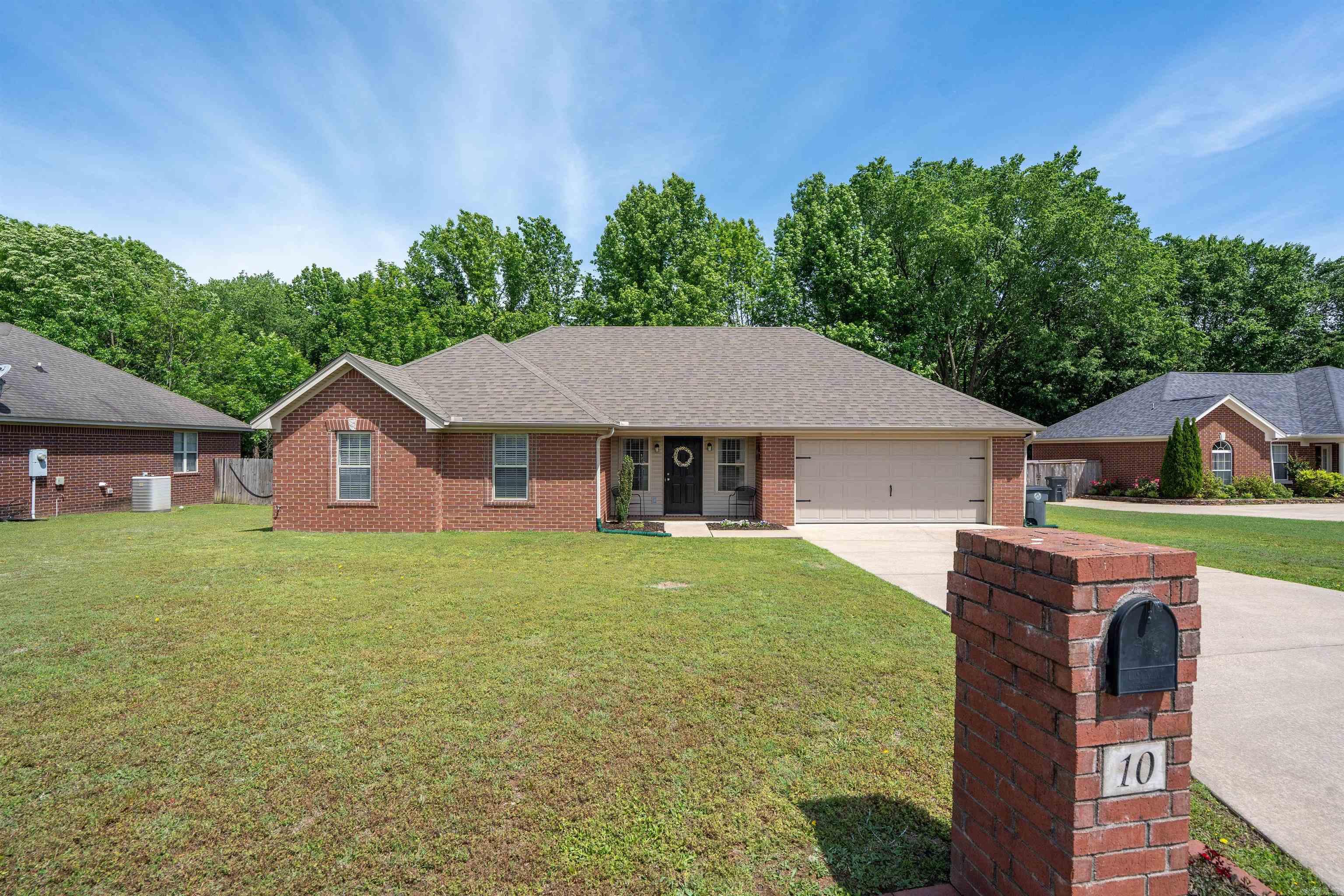 This well-designed home offers a highly functional floor plan in an established neighborhood. Featuring 3 bedrooms 2 bathrooms, the property backs up to wooded surroundings, providing both privacy & a peaceful, country-like setting. Inside, you’ll find a blend of LVP, tile, brand-new carpet throughout. The spacious living room flows seamlessly into a large dining area filled w/natural light, then into a wide galley-style kitchen w/ample cabinetry & counter space. The laundry room adds convenience w/built-in pantry storage & additional cabinets. The primary suite is generously sized, complete w/a private bath & walk-in closet. The two additional bedrooms are also nicely sized, each offering double closets. Storage is a standout feature, with extra closets throughout, a large storage room in the garage, & extensive floored attic space. Tilt windows make cleaning simple,  the geothermal heating system adds energy efficiency. Additional updates include a 1-year-old garage door, 2-year-old roof, and 1-year-old water heater. The home also comes equipped w/a security system. As an added bonus, the seller is including the refrigerator, washer, dryer. No flood insurance required. remarks