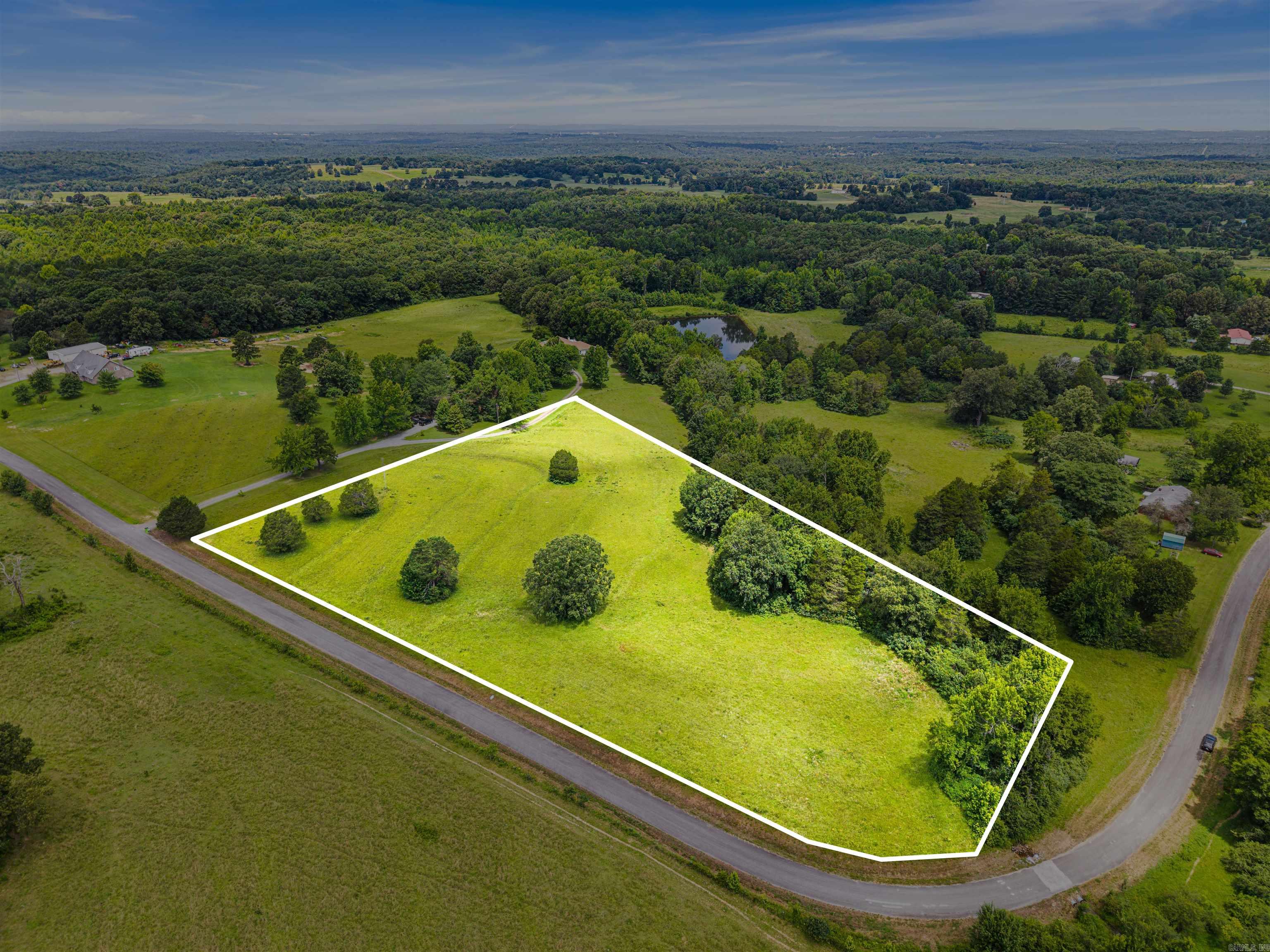 Looking for the perfect place to build? This beautiful unrestricted property offers the ideal blend of open pasture and mature timber, creating a balance of usable land and natural privacy. Whether you're dreaming of a custom home, barndominium, mini farm, or weekend retreat, the possibilities are wide open.  Enjoy the peaceful country setting, bring your animals, build what you want, and make it your own. If you've been searching for a homesite with room to spread out and the freedom to create your vision, this is the one. Mineral rights do not convey.  Can also be purchased with an additional 14.41 acres- See MLS number # 26026453.