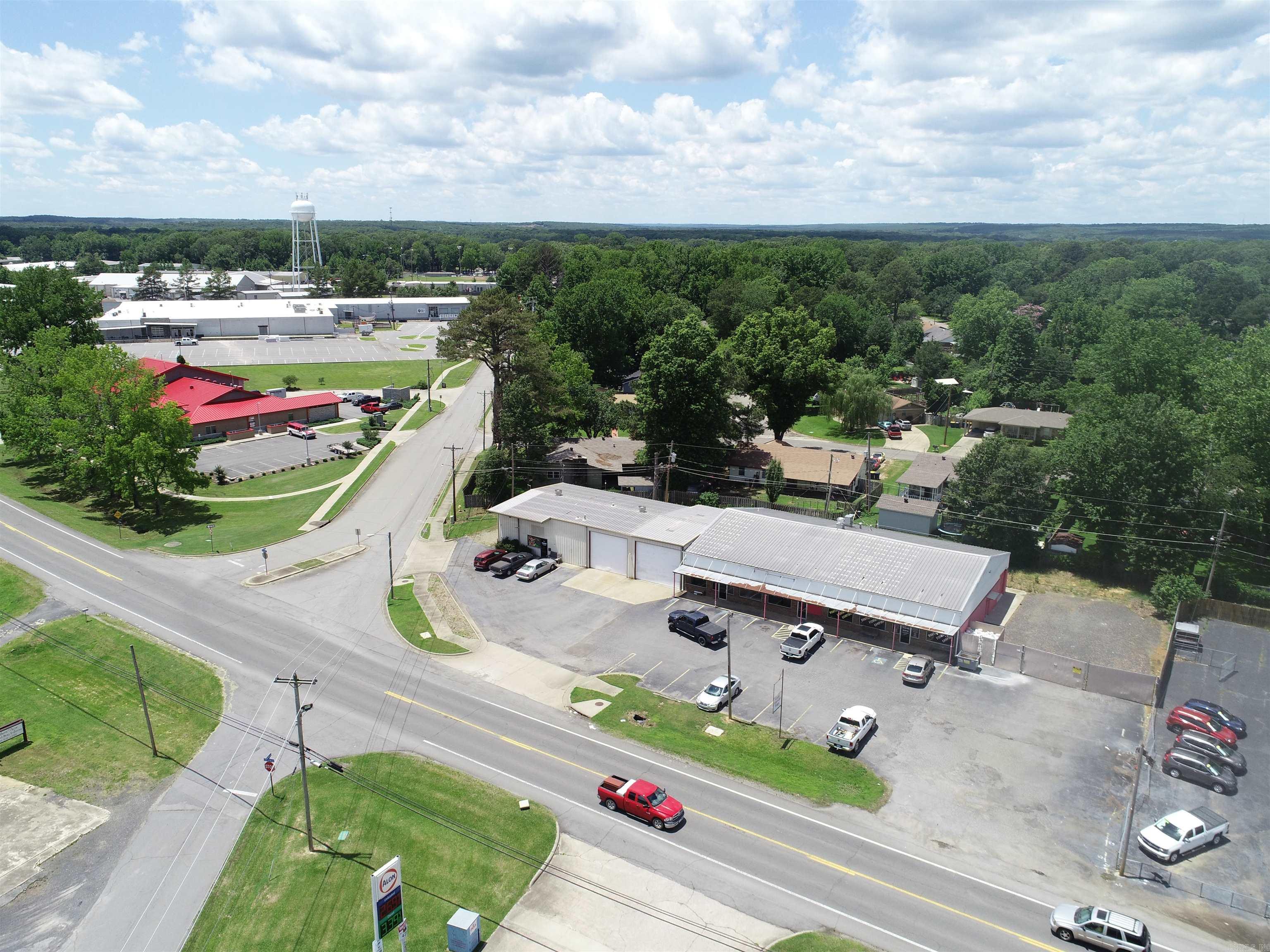 Income producing property in the heart of Cabot. 3 Separately metered spaces that are 100% occupied by 2 long term tenants. 4200 Sq ft Bait & Tackle Shop, 1200 Sq ft Retail Office, & 3,320 Sq ft pull through shop/warehouse. The Warehouse includes 1: 18' x 14' automatic overhead door, 1:  16' x 14' automatic overhead door, & 2:  10' x 10' manual overhead doors; plus 16' side walls & 18' center height. Large corner lot with 210' of Frontage on S. 2nd Street/Hwy 367, adjacent the Cabot Fire Department. Great visibility & access. Call today for more details!