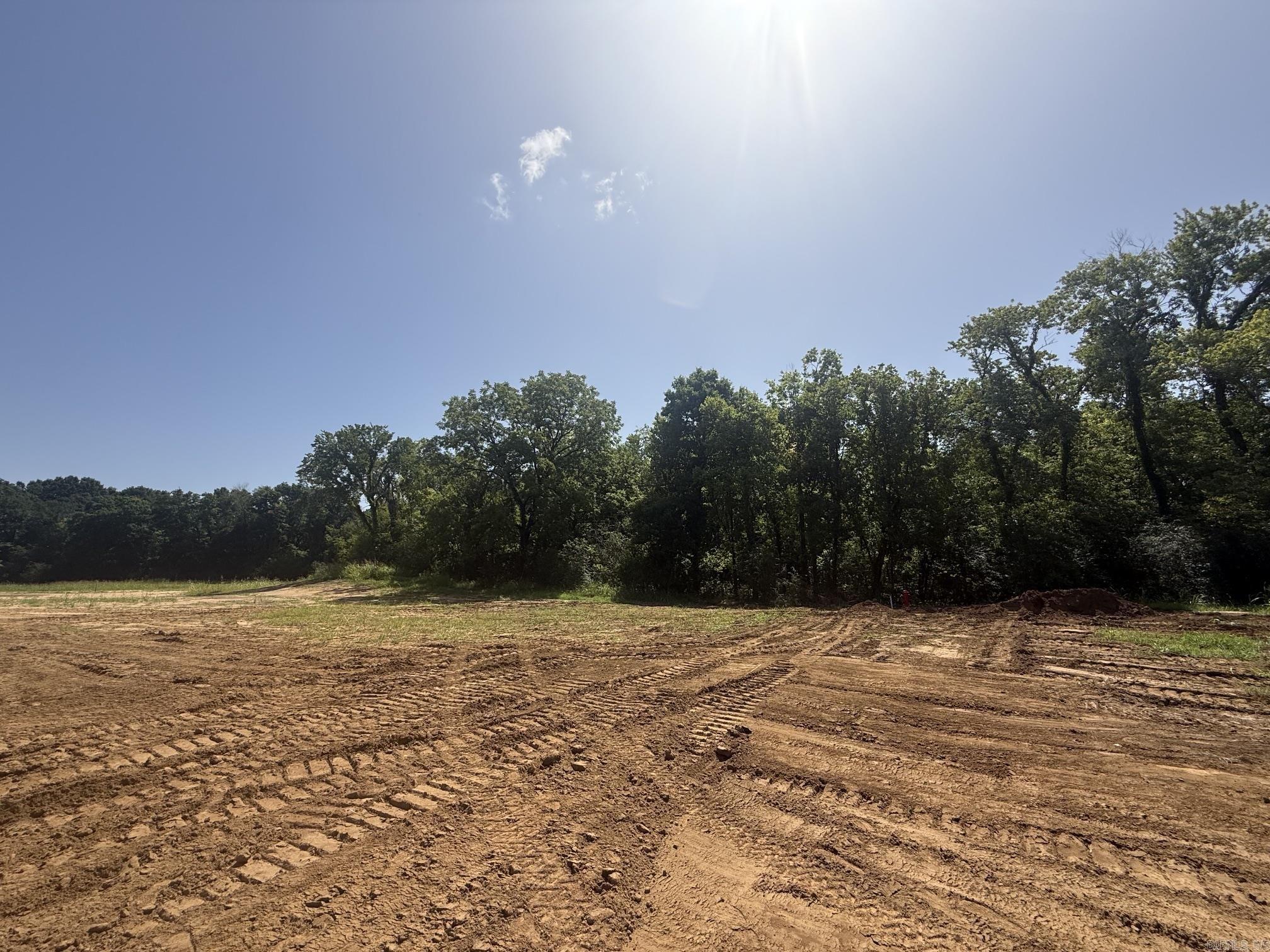 New Development inside the city limits of Heber Springs. River Wood Ranch has flat cleared lots and 19 lots along the river with trees. City sewer and water are available. Boat Ramp and Boat Dock will available by the first of 2027 for use by the residents of the subdivision. There are 8 lots that back up to the lake with views of the lake and Sugarloaf Mountain. Roads are currently gravel but as the lots are developed the roads will be paved.