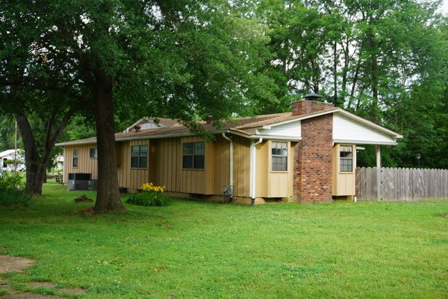 Huge living room, large kitchen/dining room, lots of cabinets and counter space. Nice stainless 3 compartment sink and walk in pantry with shelving, master bedroom is huge, has a walk in closet, there is an den with a built in wall unit with desk, there are shelves and a workbench plus a sink in the utility room. The 3rd bedroom and 1/2 bath off the utility room. This house has storage everywhere. Nice storage bldg and a slab where a shop used to be. This is an estate & is sold as is. Agents see remarks