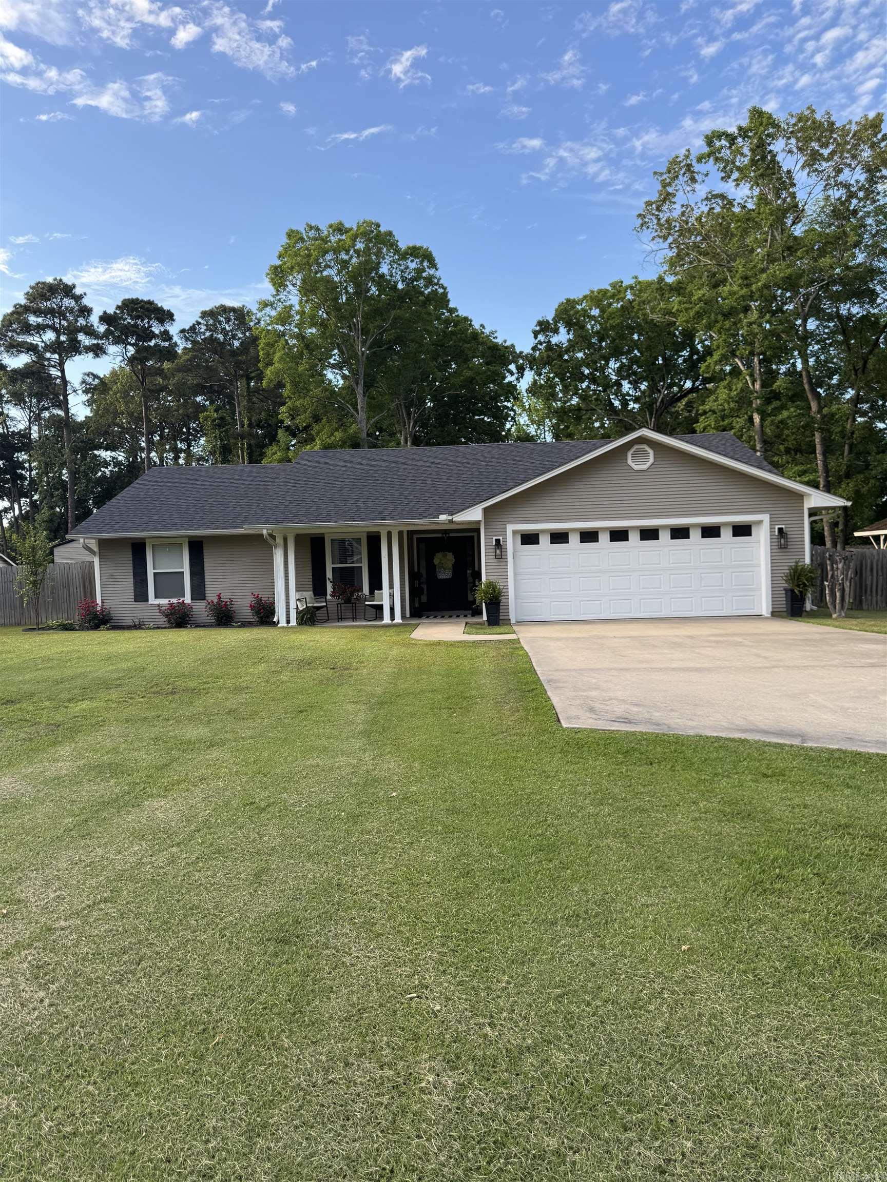 Completely remodeled and move-in ready 3-bedroom, 2 bathroom home in the heart of White Hall! This beautiful 1,774 sq. ft. home sits on a spacious .78-acre lot and is conveniently located close to the city park, elementary school, and middle school.  Step inside to find new LVP flooring throughout, new baseboards, new appliances, and a fresh coat of paint that gives the home a clean, modern feel. The huge windows across the back of the home provide stunning views of the private, expansive backyard and fill the home with natural light.  Outside, the meticulously maintained yard offers incredible curb appeal with the cutest covered front porch you’ve ever seen. The oversized backyard is perfect for entertaining with a large, covered pavilion and a covered back porch for relaxing evenings outdoors.  This home also features plenty of closet space, a dedicated laundry room, and all the updates you’ve been looking for. Don’t miss your chance to own this beautifully updated home in a fantastic White Hall location!