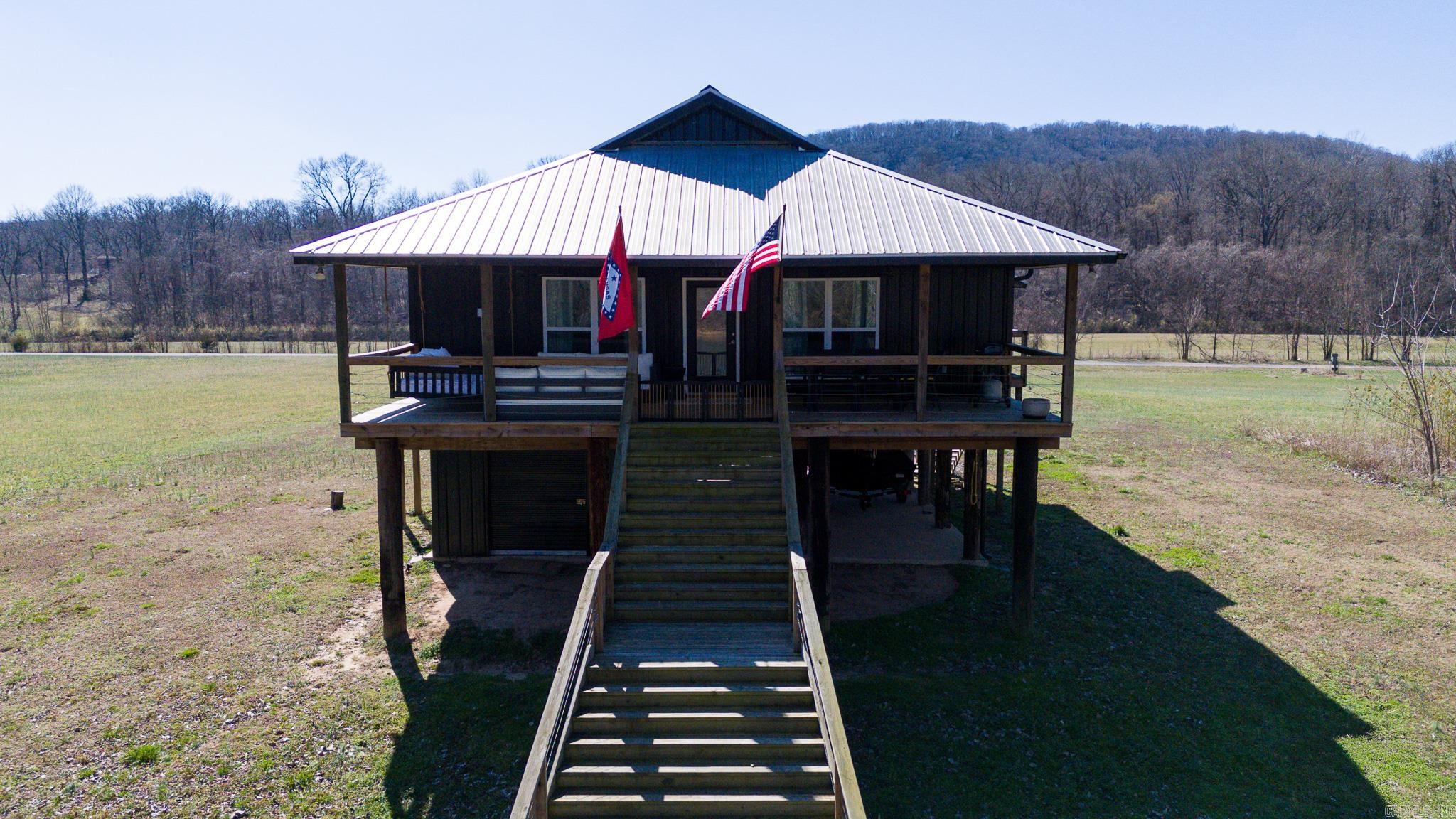 THIS SETTING, THIS HOUSE and THIS VIEW! When you only have time to view THE BEST, make sure you check out 108 Upper Yorktown Rd. SCENICALLY SUPREME, this home is great as an INVESTMENT PROPERTY or for as your own personal retreat! Located in a gated community with White River frontage, a neighborhood boat ramp and short drive from Batesville AND Mtn. View! AT YOUR SERVICE! The conveniently designed kitchen has ample countertop space, a spacious island and stainless appliances. Both bedrooms are ROOMY with their own private bathrooms. An additional 1/2 bath and bunk room make ENTERTAINING EASY! Enjoy lazy afternoons swinging on the porch of your covered deck. This MULTI-SEASON RETREAT is the perfect INVESTMENT!