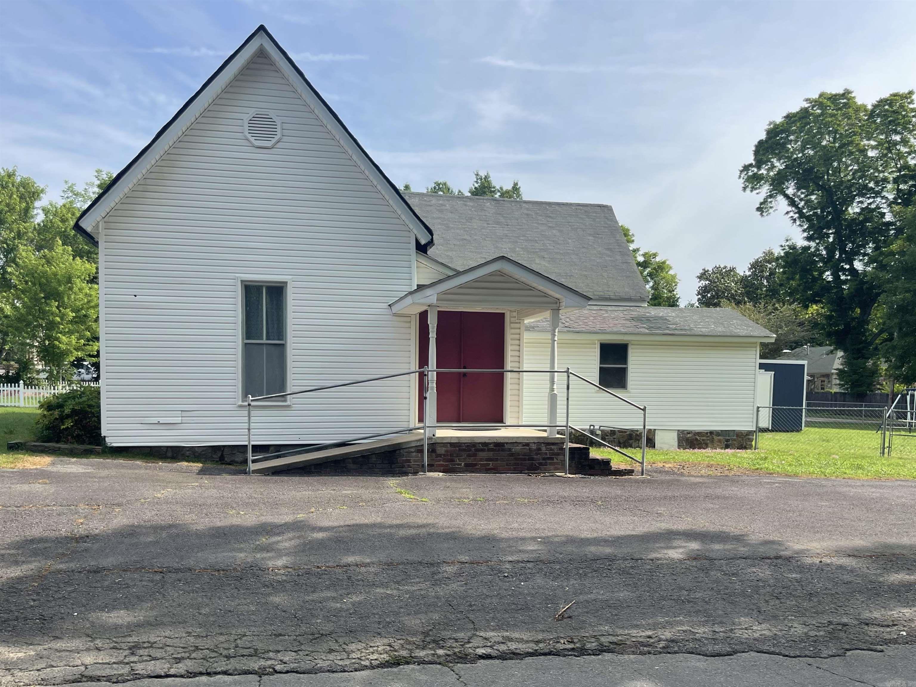 Great opportunity in the heart of downtown Heber Springs. This unique church property offers an open-concept gathering space filled with potential for a variety of uses. Features include a kitchen, two restrooms, and a fenced outdoor area perfect for additional gathering or recreation space. Conveniently located with easy access, this property could serve as a continued place of worship, community center, event venue, office space, or creative redevelopment opportunity. Endless possibilities in a prime location!
