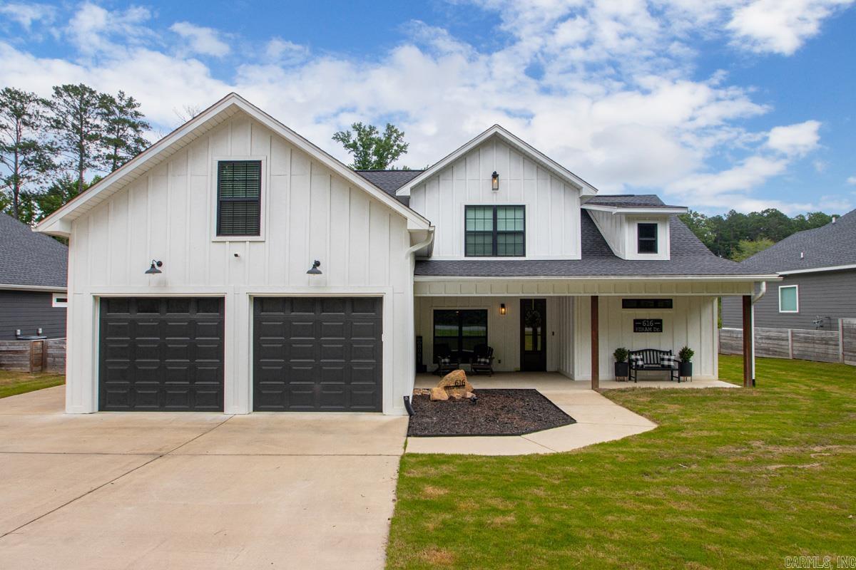 Move-in ready, and loaded with curb appeal! This beautifully maintained home features attractive Hardie Board siding and custom touches throughout, including floating shelves, wood beams in the great room and primary suite, and stylish accent walls.The kitchen is designed for both everyday living and entertaining, with a farmhouse sink, gas stove, quartz-topped breakfast bar, granite countertops and abundant cabinet space. You'll also love the formal dining room, oversized laundry room with mudroom area, and large pantry with barn doors. Luxury vinyl plank flooring runs throughout the downstairs living areas and even continues up the staircase.The spacious primary suite is on the main floor, and it features a custom tiled shower, soaking tub, double vanities, private water closet, and a large walk-in closet with custom built-ins that convey with the home.Upstairs, you'll find two bedrooms, each with its own accent wall, along with a large bonus room that offers endless possibilities.Outside, enjoy the private, fully fenced backyard complete with a huge patio, wood-burning fireplace, and access to a convenient 10' x 9' storage area. Storage in garage and additional parking pad, too!