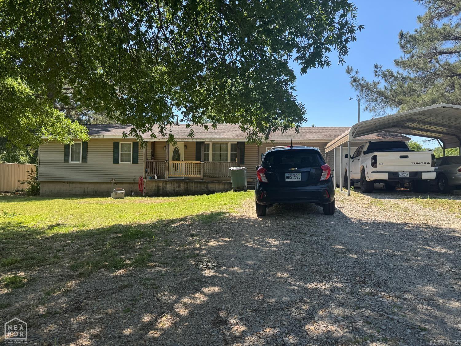Located on Manley Lane in Brookland, this property offers a rare opportunity inside the city limits with approximately .97 acres, more or less providing a near one-acre lot that gives a country feel while still being convenient to the amenities of town. The home features approximately 1,700 sq. ft. of living space with 3 bedrooms, 2 bathrooms, and two separate living areas. A large den on the back of the home includes a free-standing wood stove, adding character and functionality. This property is well suited for investors or owner-occupants looking for a value-add opportunity. With some remodeling, this home has strong potential and is priced aggressively so a new owner can remodel and make it their own.