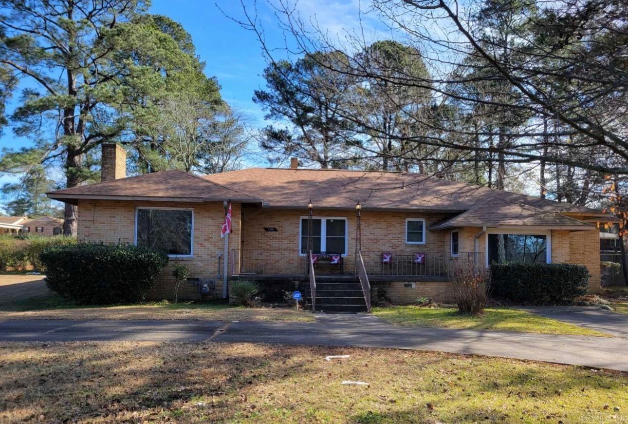 Updates as of February 2026: New joists and new flooring in areas of the home!   This beautiful home sits on a corner lot that is literally walking distance from Southern Arkansas University campus and three minutes away from downtown Magnolia. The property has updates such as new windows, new roof and new privacy fence all added around 2018.