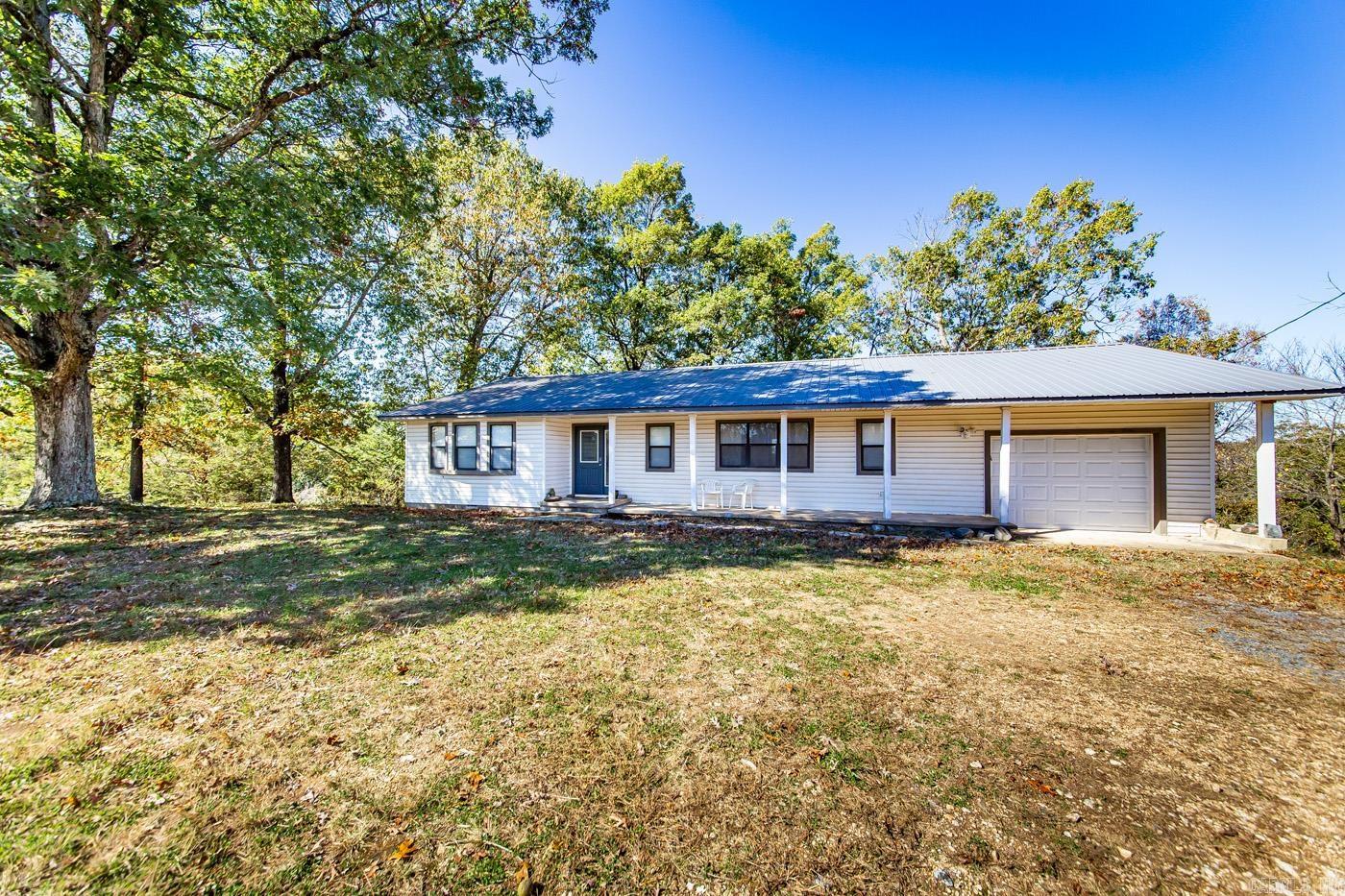 Welcome to the market, 2740 Red Bluff Road, Marshall, Arkansas   Discover the perfect blend of serenity and comfort at 2740 Red Bluff Road, Marshall, Arkansas. Nestled in the heart of nature, this picturesque 3-bedroom, 2-bathroom home with 1,842 square feet and amazing views, offers a unique opportunity for those seeking a tranquil lifestyle.   Key Features    Scenic Acreage: Situated on 4.51 +/- acres of gently sloped countryside, this property is a nature lover's paradise.  Wildlife abound with Deer, Turkeys, small game and an occasional Bear traveling through the property.  There is a variety of cleared and wooded areas on the parcel as well.    Spacious Residence: The charming 3-bedroom, 2-bathroom home boasts 1,842 square feet of living space, offering ample room for your family.  There is a garage with overhead door and a partial basement for your canned goods and general storage as well as storm shelter when occasionally needed.  The home is being sold completely furnished with all existing appliances conveying with sale.    Breathtaking Views: Enjoy stunning sunsets from your very own back deck, with views for miles!