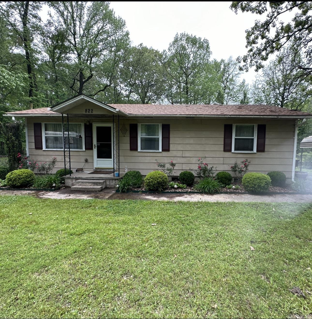 Check out this immaculate 3 bedroom home in Pine Bluff with 3 lots! Completely fenced backyard and roof is only 5 years old! This home is beautifully landscaped and has 2 storage sheds with electricity in the backyard! Washer and dryer stay with the home! This solid, well built home, offers all window treatments, carport, double insulated windows, ceiling fans, central heating and air, birch custom cabinets in the kitchen and a laundry room! All of the existing alarm system equipment conveys with the home as well! New hot water heater is only 2 years old! The attic is floored for all your storage needs! This home features gutters, outside motion lights, and a whole house surge protector! This well maintained home is one of a kind and you can enjoy the peaceful backyard from the back patio! Call me to set up your showing today!