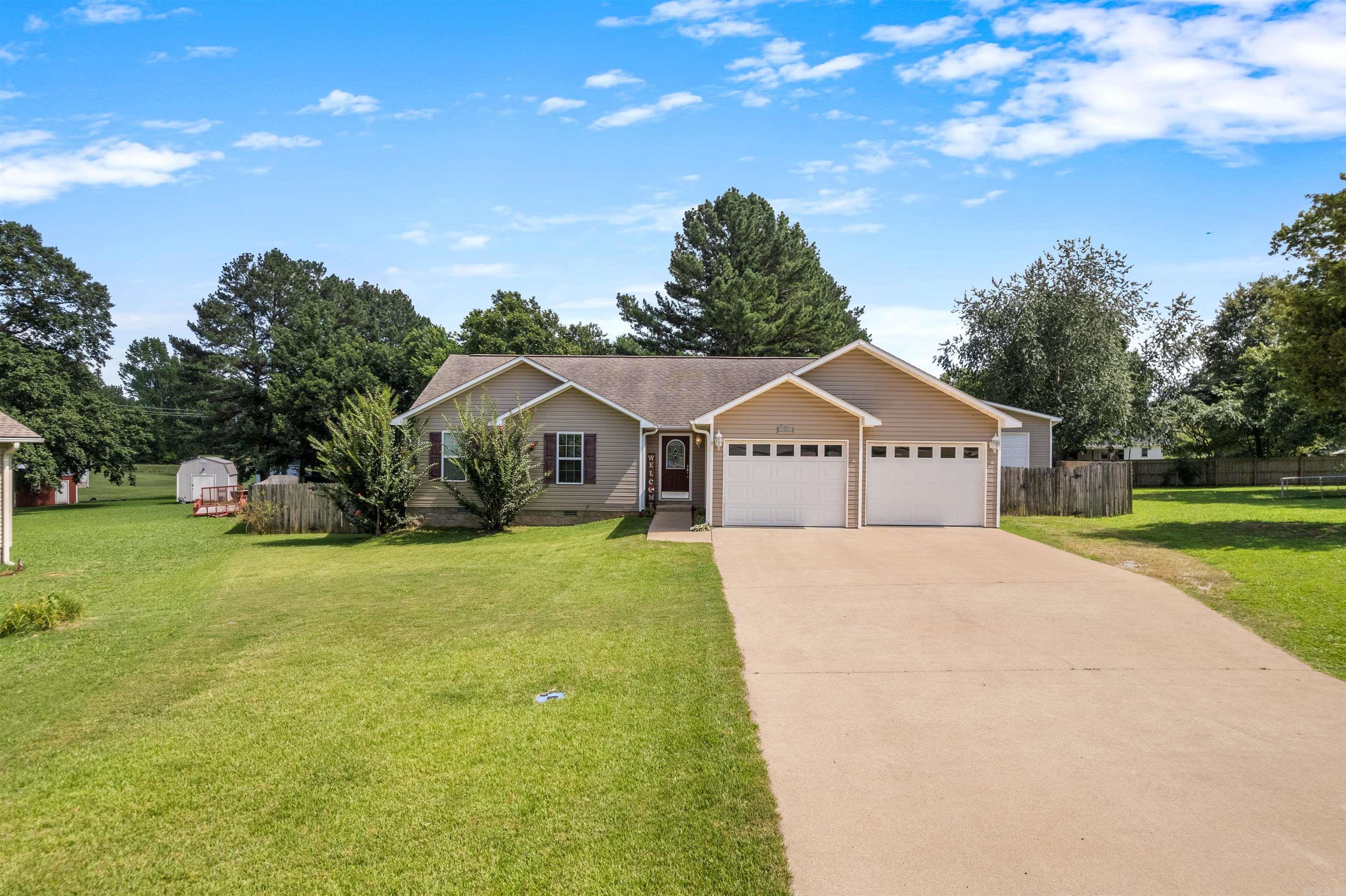 If you've been looking for a home with space to spread out, a functional layout, and an incredible shop, this is it. Situated at the end of a quiet cul-de-sac in a desirable subdivision, this 3-bedroom, 2-bath home offers 1,683 square feet of thoughtfully designed living space on over half an acre. Inside, you'll find real hickory hardwood floors, crown molding throughout, and an open layout that feels both warm and welcoming. The spacious living room opens to the kitchen, where you'll have a eat-in-bar with an additional dining area. Outside, enjoy a fully fenced backyard, a covered deck for entertaining, and a detached shop featuring an insulated, cooled bonus room that's ideal for an office, gym, or creative space. Located just 10 minutes from shopping and dining, this home offers the perfect blend of privacy and convenience.