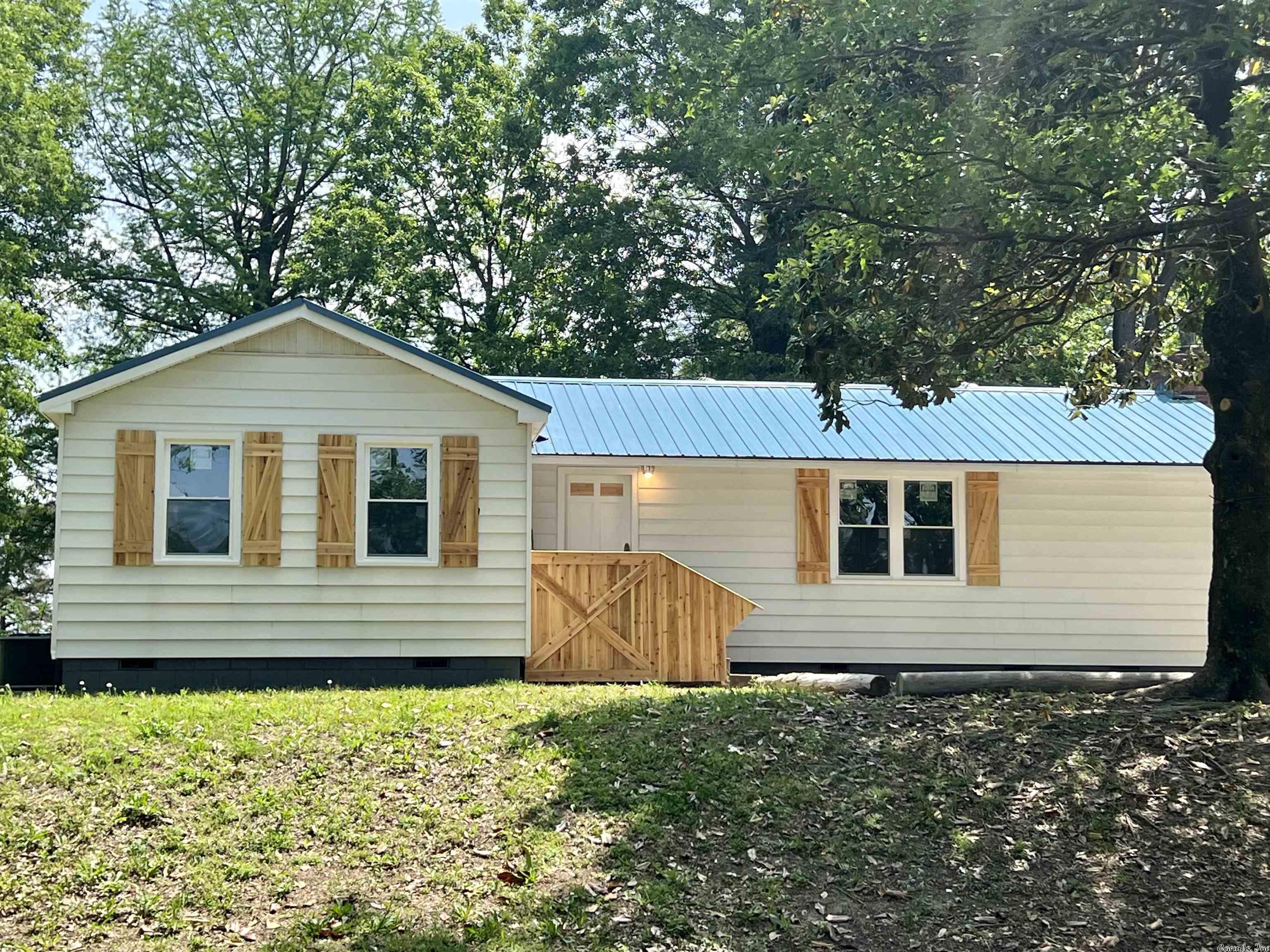 Cute, remodeled, and secluded! This great 2 bedroom, 1 bath home sits on a hill at the end of a county road offering lots of privacy! From the front porch, be welcomed into the house beside the dining area. The living room boasts a wood burning fireplace with lots of natural light coming in through the new windows. The kitchen features an abundance of cabinets with the laundry room serving as a transition between the main portion of the home and the backyard. The two bedrooms and tiled bathroom finish out the interior of the property. Outside the home is a 24'x32' shop and a large pond wrapping around the side of the home. Call today to check out this beautiful home!