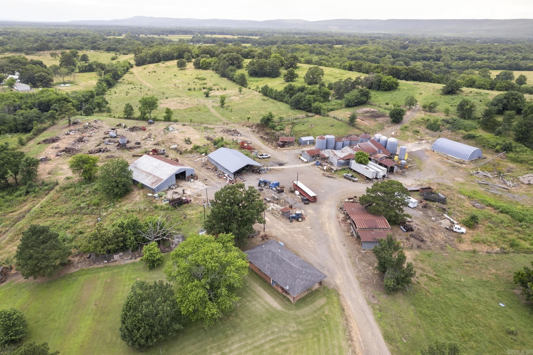 300+- acres with a working cattle and horse ranch.  Includes 4 ponds and running stream.   Owner is downsizing and two houses are included in the sale.  See photos for outbuildings which includes a GRAIN MILL setup that operated for 22 years.  Roof was partially damaged during last ice storm.  Expand your current ranch or consider this ranch a possible addition.  Dream of owning a ranch with grazing land and a hay pasture? This is for you.  AGENTS SEE REMARKS