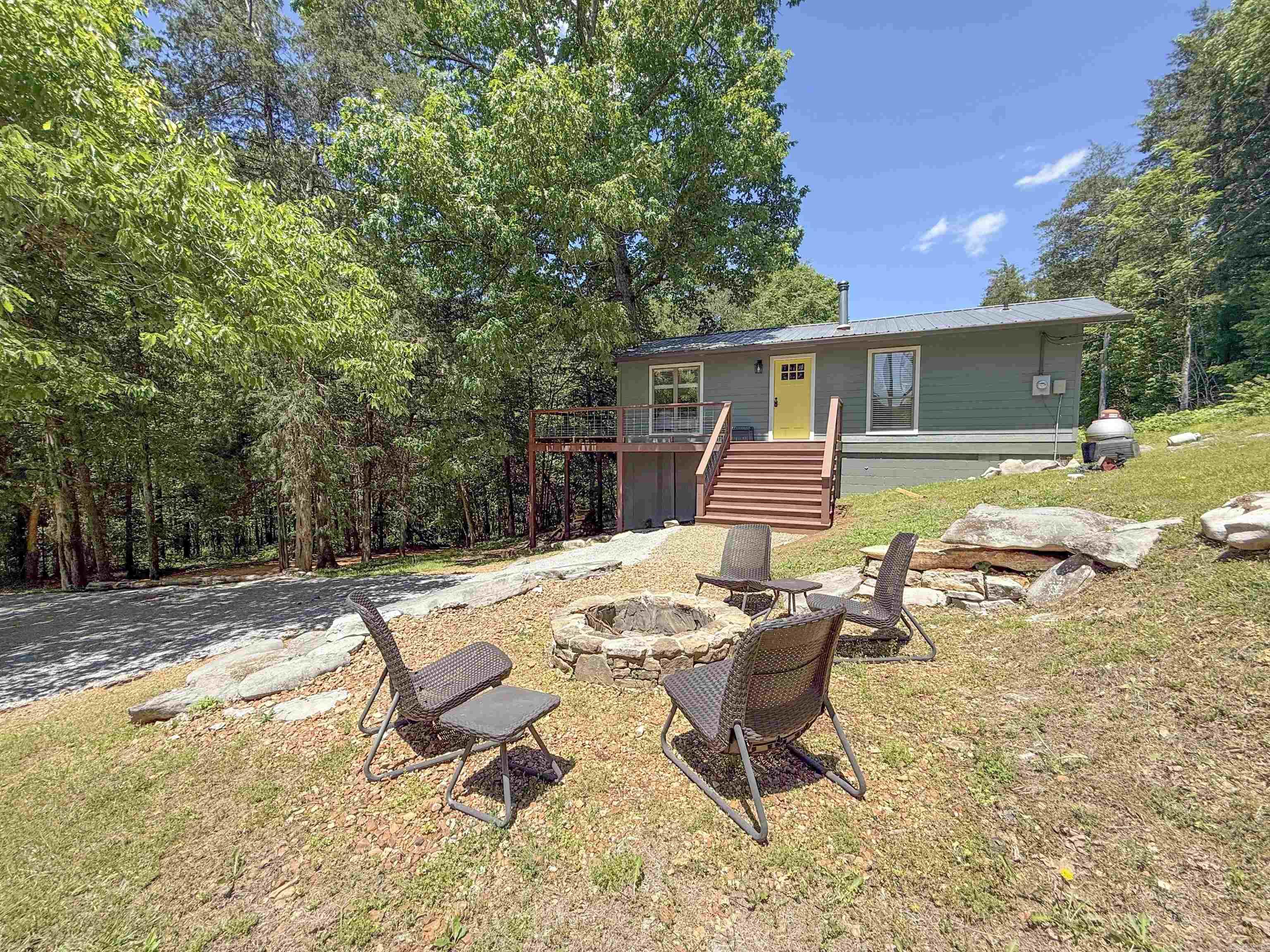 Nestled on 7.5 acres m/l in the beautiful Ozarks, this freshly remodeled 2-bedroom, 1-bath home offers the perfect blend of privacy, comfort, and natural beauty. Enjoy views overlooking Sylamore Creek, with part of the property extending all the way to the creek bank, giving you a rare opportunity to own your own slice of this sought-after area. The home has been tastefully updated with fresh improvements throughout, creating a move-in-ready retreat for full-time living, a weekend getaway, or a vacation rental opportunity. Conveniently located just minutes from Mountain View and close to Blanchard Springs, you'll have easy access to hiking, fishing, floating, caverns, music, and all the outdoor recreation the area is known for. If you've been searching for peaceful country living with creek views and acreage, this property is one you won't want to miss.