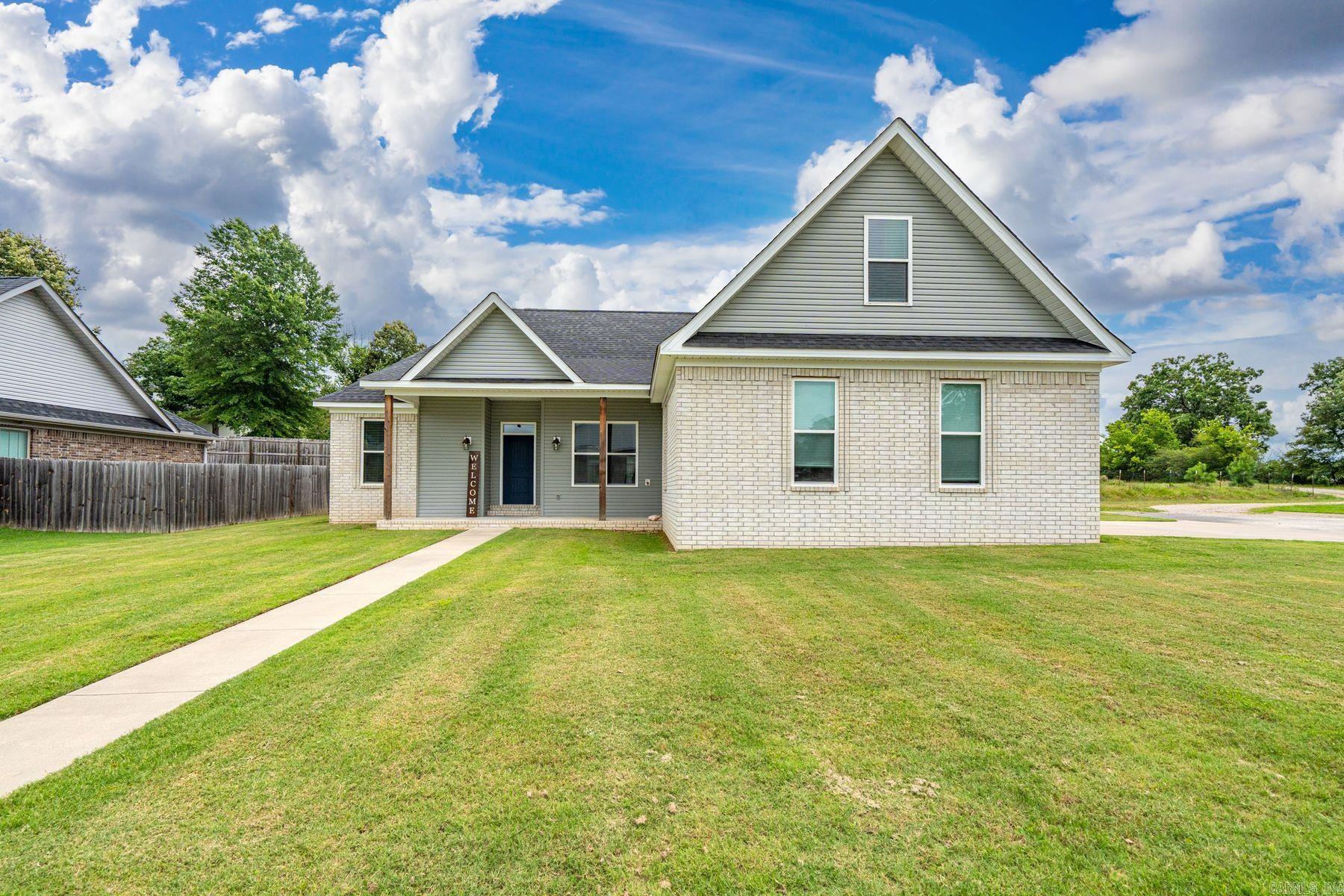 Built in 2019 and exceptionally well maintained, this 3-bedroom, 2-bath home offers modern finishes, thoughtful updates, and a versatile bonus room that could serve as a home office, hobby room, media room, or 4th bedroom. The open-concept floor plan features granite countertops, a gas range, and a cozy gas fireplace, creating a comfortable space for everyday living and entertaining. Recent improvements include brand-new carpet in all bedrooms (replaced after the photos were taken), a 2026 tankless water heater, a roof replaced in 2023, and a recently serviced HVAC system. The refrigerator will convey with the property, adding to the home's move-in-ready appeal. Situated on a corner lot with no homes directly behind, the property offers added privacy and an open feel. Located within the Lake Hamilton School District and convenient to area shopping, dining, and recreation, this home combines modern amenities, recent updates, and a desirable location. Mandatory $120/year fee covers street lights and landscaping at the entrance. Don't miss the opportunity to make this beautiful property your next home.