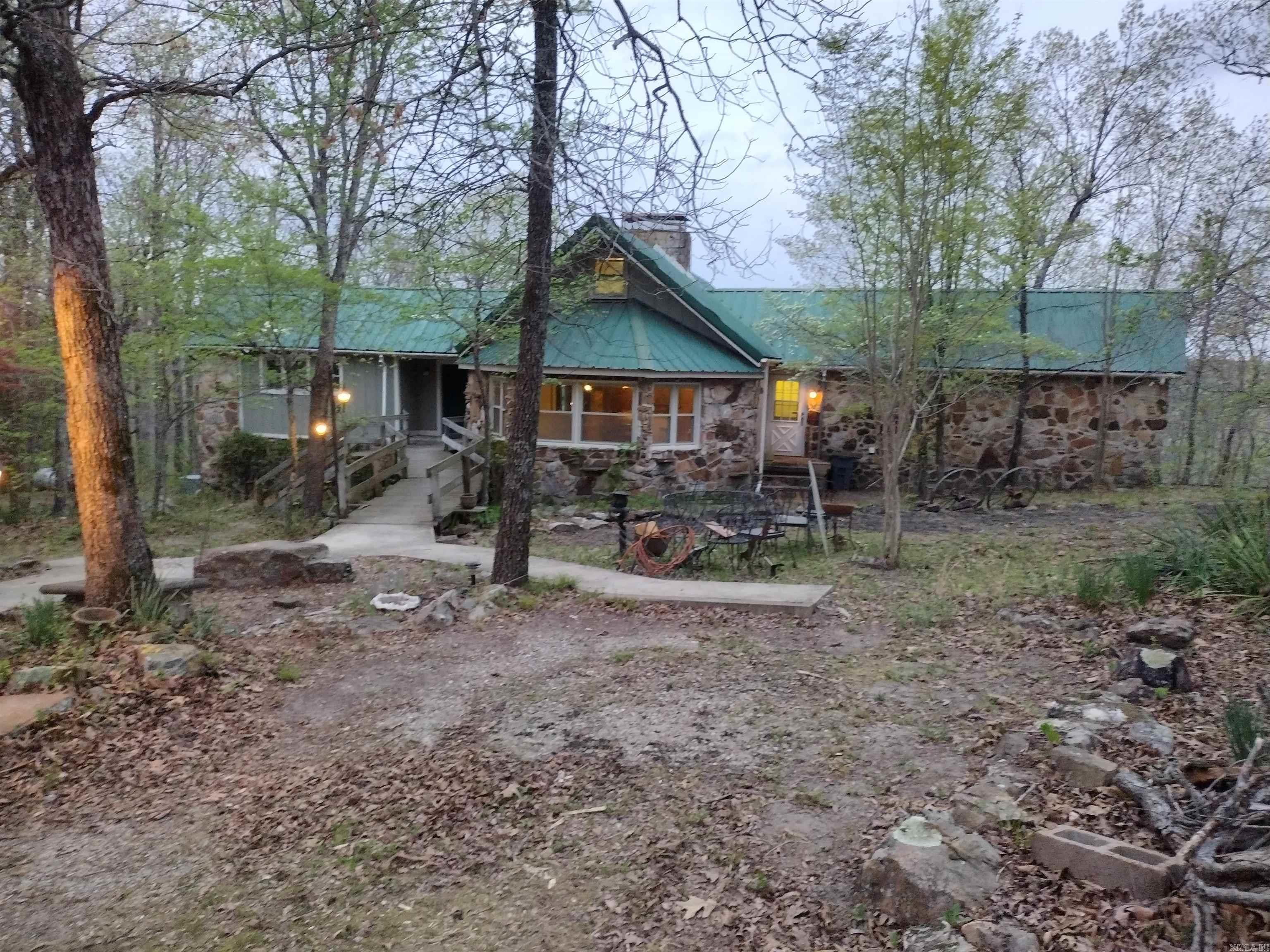 One-of-a-kind property offering 194 acres M/L with incredible views of the White River, surrounding mountains and open field this property features a house, 4 finished cabins, 1 ready to be finished all offering the own special view and a maintenance building with living quarters, providing multiple opportunities for residential, recreational, and income producing. this land has Ozark National Forest on 3 sides with White River frontage on the other for supreme private retreat. Property includes a rare and attractive balancing rock formation that would be great to add a wedding venue. With existing improvements this property is well-suited for short-term rentals, retreat-style lodging, for a hunting and fishing lodge to do guided trips also plenty of room to add more cabins to make even better retreat, boat ramp just minutes down the road. This is a rare opportunity to own this special property with unlimited potential. Photos do not adequately capture the beaty and uniqueness this is a must-see property I have lots more photos that can be sent at request.