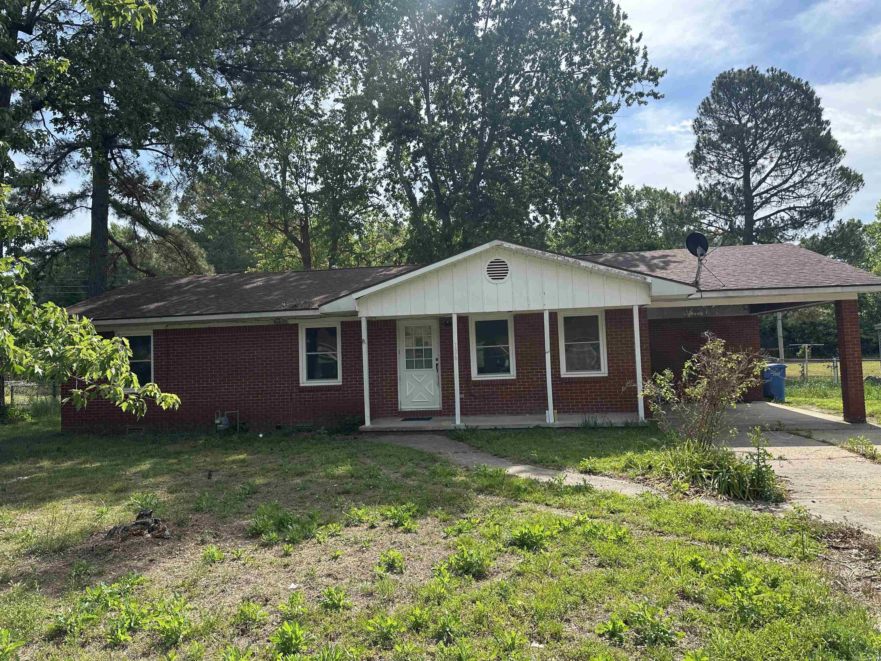 This brick ranch style home is in Corning Arkansas. Home of the Victory Lake Golf Course. Minutes from the Black River where some of the best recreational activities can occur such as hunting, fishing, hiking and boating. The interior offers three bedrooms with a large open bathroom. The living area is toward the front of the house so you can utilize the windows and front porch area. The dining area/kitchen breakfast area open up the kitchen and laundry area off of the carport. **Agents see agent remarks**
