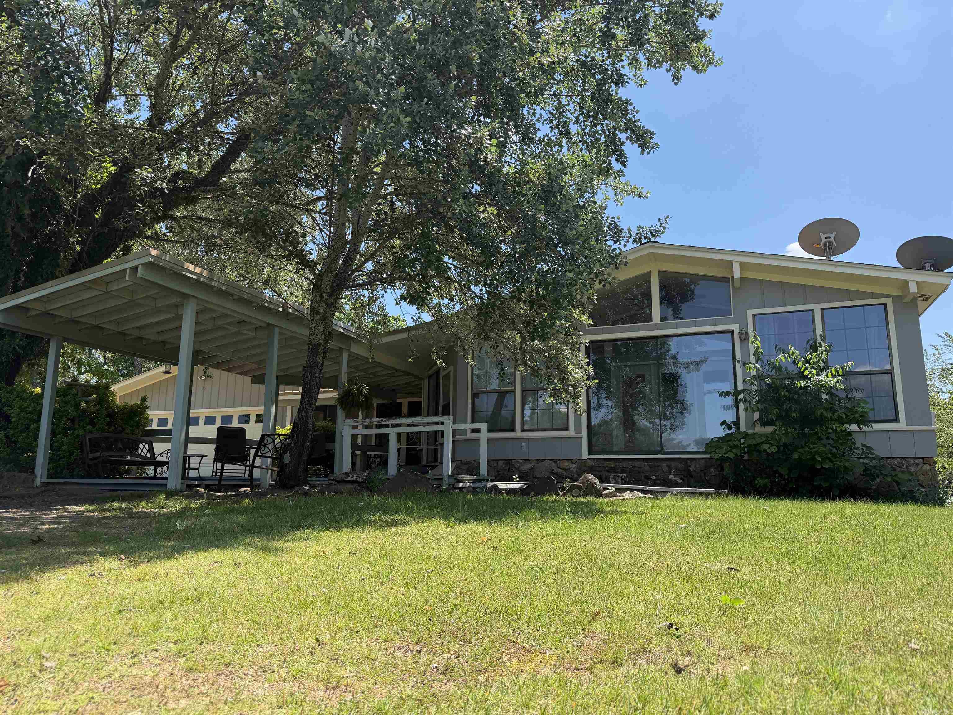 This gem would make a great starter home or to downsize in the heart of Greers Ferry. Just needing your special touch to make it yours. Between the garage and storage shed plenty of room for some toys or yard tool's. Sun room with plenty of natural light. Large primary bedroom with bathroom. Don't hesitate to take a look. Agents see remarks.