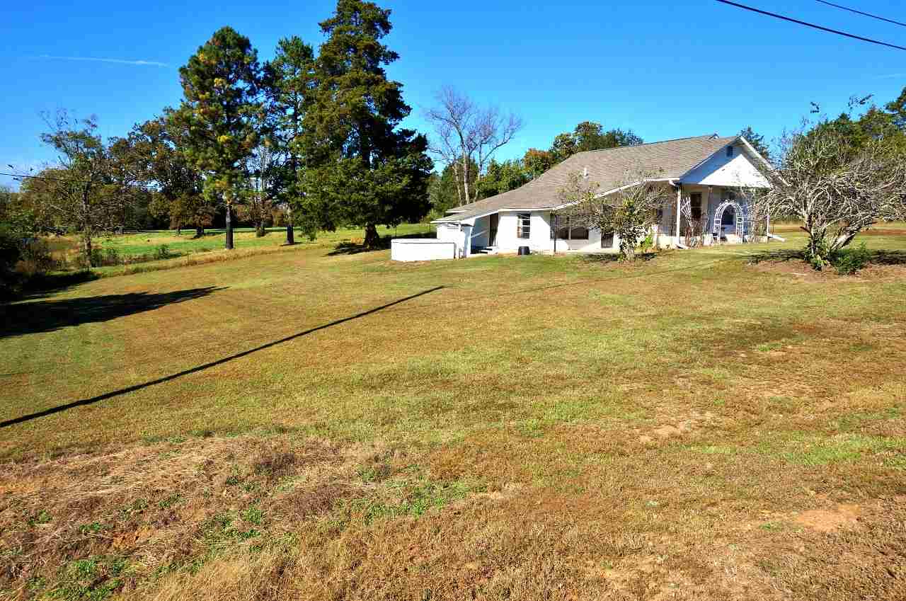 This is a great deal for anyone needing a home with pasture and pond for a low price.  The property has a large older home, a small mother-in-law home with a bathroom and small kitchen, a few sheds, metal carport, and 15 beautiful pasture acres.  Pond is shared with the neighbor.  New roof with architectural shingles. Storm shelter beside home. Mineral rights do not convey, and home will not qualify for Rural Development or VA (could use a few repairs here and there, but mostly in good shape).