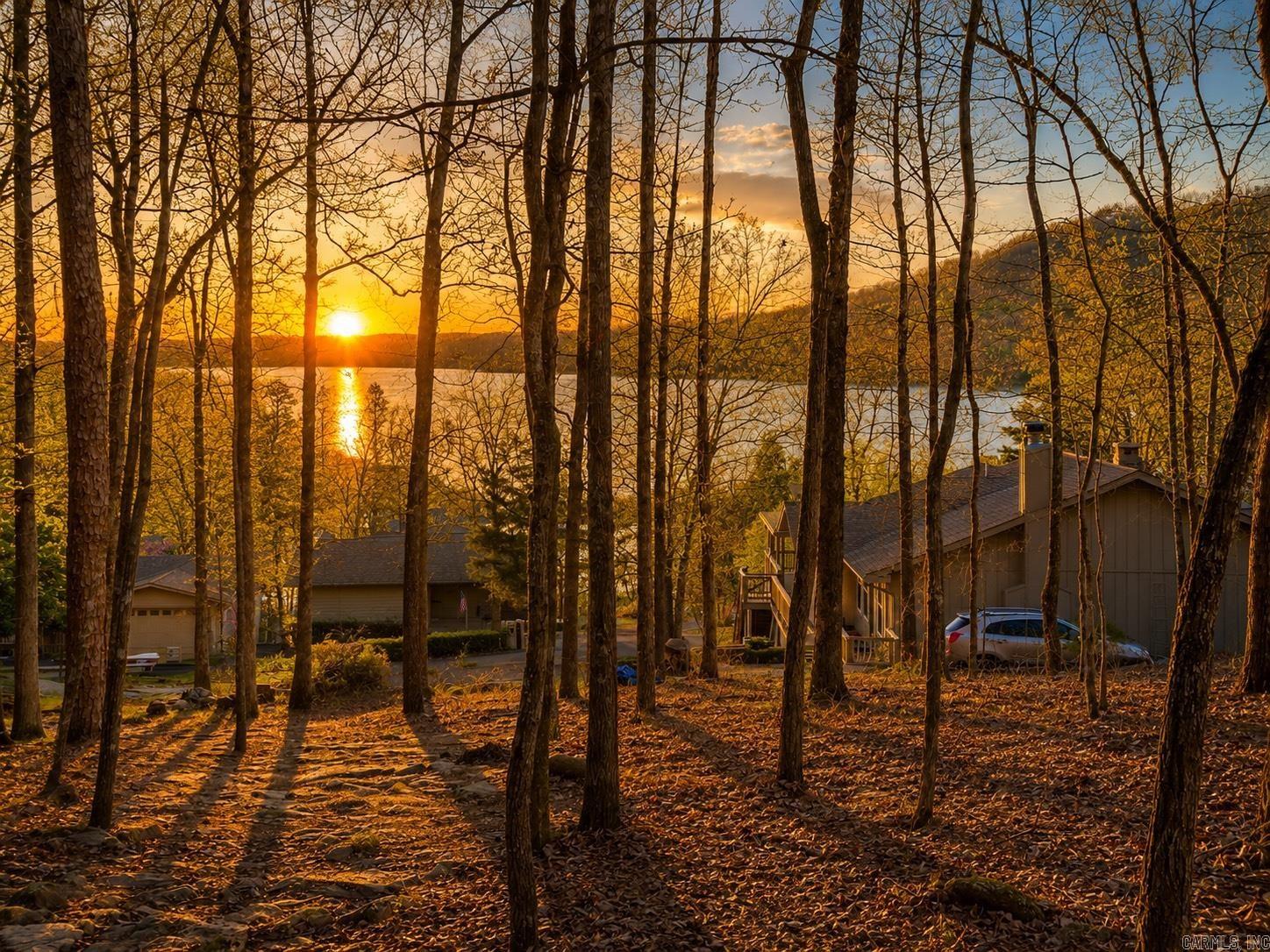 Build your dream home with beautiful Greers Ferry Lake views on this rare 0.94± acre homesite in Hamilton Hills Subdivision! Created by combining three original lots into one spacious parcel, this property offers added privacy, extra room to build, and a unique setting in one of Fairfield Bay’s desirable neighborhoods. Enjoy paved road access and convenient proximity to Fairfield Bay’s marina, golf courses, hiking and ATV trails, pickleball, restaurants, and year-round recreation. Whether you’re looking for a full-time residence or a weekend getaway, this is an exceptional opportunity to own nearly an acre with scenic lake views in the heart of the Ozarks. Utilities available nearby.