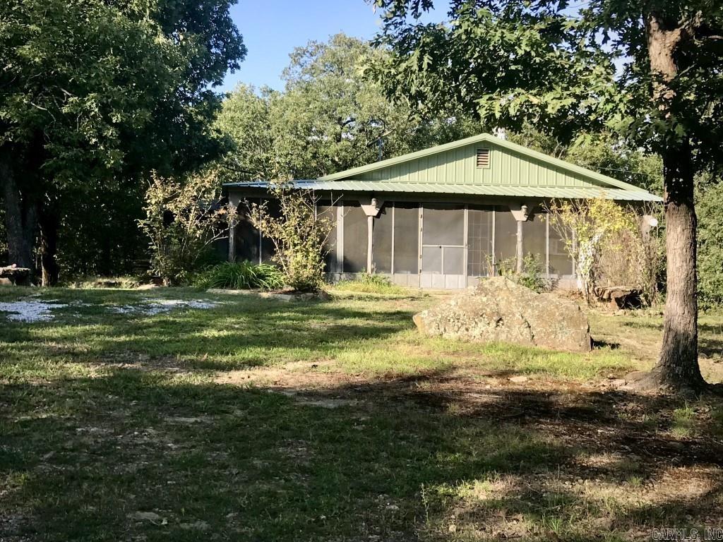 Hillside Cottage on 2.5 Acres - $119K  Listing No. 02336   986 Sunnyland road, Mountain View, Arkansas Escape to your 648 sq ft hillside cottage on 2.5 acres with woods. Features include: - Large fenced yard with gate. - Generac whole house generator. - 2020 model appliances. - Two screened porches. - Window air and propane ventless heat. - Open front shed. - Chicken coop. - Unfinished storage house with a bathroom. - No restrictions. - County gravel road frontage. - Private, yet close to town. Don't miss this gem! Contact Georgie Church at 870-213-6209 for a showing.