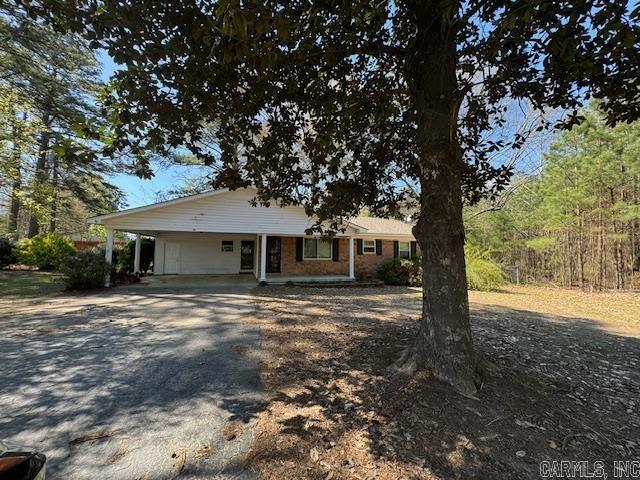 So much space, so much potential!  Home is sitting on 1.64 acres located just a few minutes from Glen Rose school. Surrounded by beautiful flowers and mature trees your country oasis awaits.  The 1974 sq ft home has 5bedrooms and 3 bathrooms.   Price also includes an 18X20 Studio that has endless possibilities, a 30'X40" shop, and a 30x34 pole barn. With a little TLC this could be the home of your dreams.
