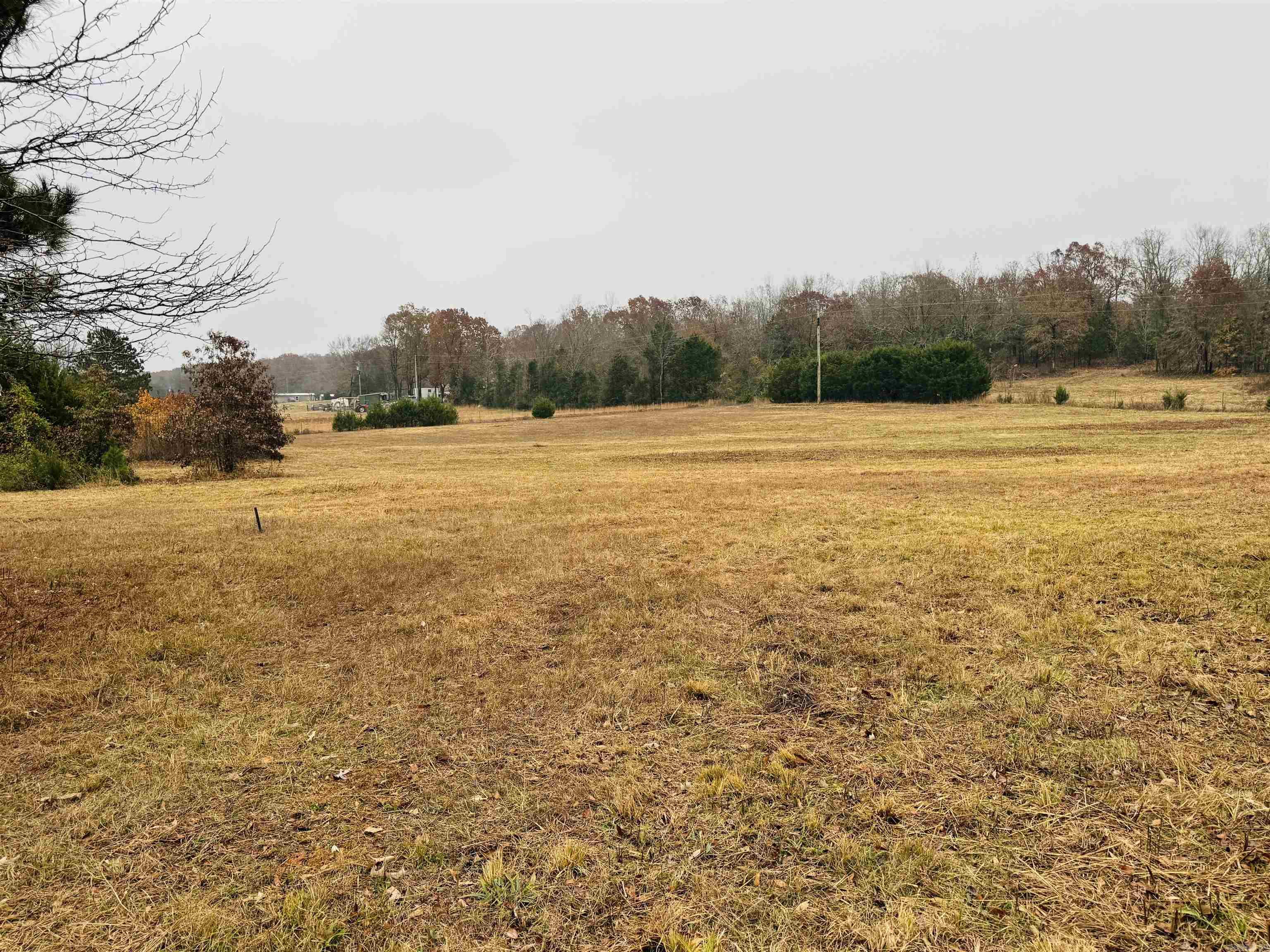 Looking for that special place to call home? This Picturesque setting would be the perfect place to build your dream estate!  This property has gently rolling pastures great for horses or livestock with mature trees to give evening shade.  Water, Fiber and electric are all available to hook up, and test holes for septic have been dug. This 7.73 acres would make a beautiful home place to buy and build later or if wanting to bring the whole family build a couple homes. There is approximately 75 foot road frontage on Faulkner gap and 500 foot on Jetta lane. Take that beautiful drive out and scoop up that perfect place to call home!