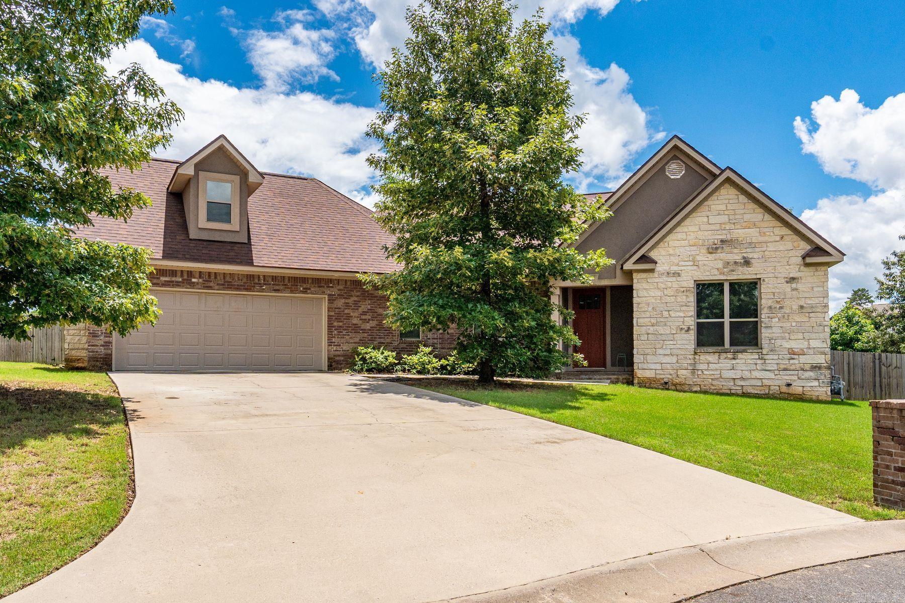 Built in 2019, this 4-bed, 3.5-bath home offers 3,020 sqft of thoughtfully designed living space, including a dedicated office and formal dining room. Featuring a split-bedroom floor plan, the home showcases quality finishes throughout, including tile and carpet flooring, crown molding, and detailed trim work. The spacious living area is anchored by a floor-to-ceiling stone fireplace with gas logs and enhanced by wood beam ceilings, creating a warm and inviting atmosphere. The oversized laundry room adds everyday convenience. The gourmet kitchen features granite countertops, a large center island, 6-burner gas range, double sink, walk-in pantry, breakfast nook, breakfast bar, and abundant cabinetry. The primary suite includes an en suite bath and walk-in closet. Two additional bedrooms are located on the main level, with a fourth bedroom and private bath upstairs. Additional highlights include a tankless water heater, mudroom with built-ins, and a 2-car garage with backyard access. Professionally landscaped grounds feature a heated inground pool, covered patio with ceiling fans, gas firepit, and a fully fenced backyard—ideal for relaxing or entertaining.