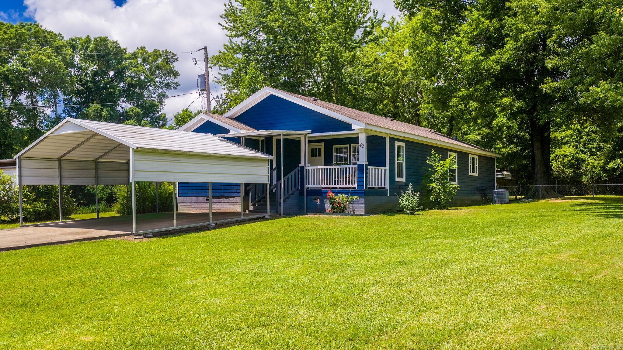 This is a manufactured home. Located across the street from Lake Conway and UPDATED !!!!!!! This split 3 bedroom, 2 bath home has 1746 sq ft. Roof is 5-6 yrs old, The refrigerator, dishwasher, stove, floors, HVAC, exterior & interior paint, 2 car carport, counter tops & backsplash, septic & field lines, a 21' X 12' metal building, and 2 toilets are all 2-4 years old. Kitchen has an  island & a nice size laundry. Fenced back yard with a deck for entertaining. Two beautiful shade trees.  This home is a must see. Please see agent remarks.