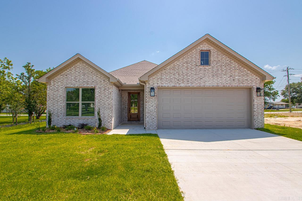 Welcome to your dream home! This stunning new construction, located in one of Benton’s newest subdivisions, is conveniently situated close to shopping & dining. Step inside to a welcoming entry that sets the tone for the rest of the home. The main living boasts an open concept design, perfect for both entertaining & family living. The kitchen, dining, & living room flow seamlessly together, creating a warm & inviting space. The kitchen is a chef’s dream with gorgeous quartz countertops & ample cabinet space that extends to the ceiling. The living room features stunning beam work, built-ins, & a charming brick fireplace, making it the perfect spot to cozy up. The spacious primary suite offers LVP flooring & elegant tray ceilings. The ensuite bath is a true retreat w double vanities, a walk-in tile shower, and a freestanding soaker tub. The primary closet offers ample space for all your wardrobe needs. The two additional bedrooms & bathroom are designed with care and attention to detail, providing comfort and style. Step outside to a covered patio w tongue and groove ceilings, overlooking the beautiful, fully fenced lot located in a quiet cul-de-sac, providing privacy & tranquility.